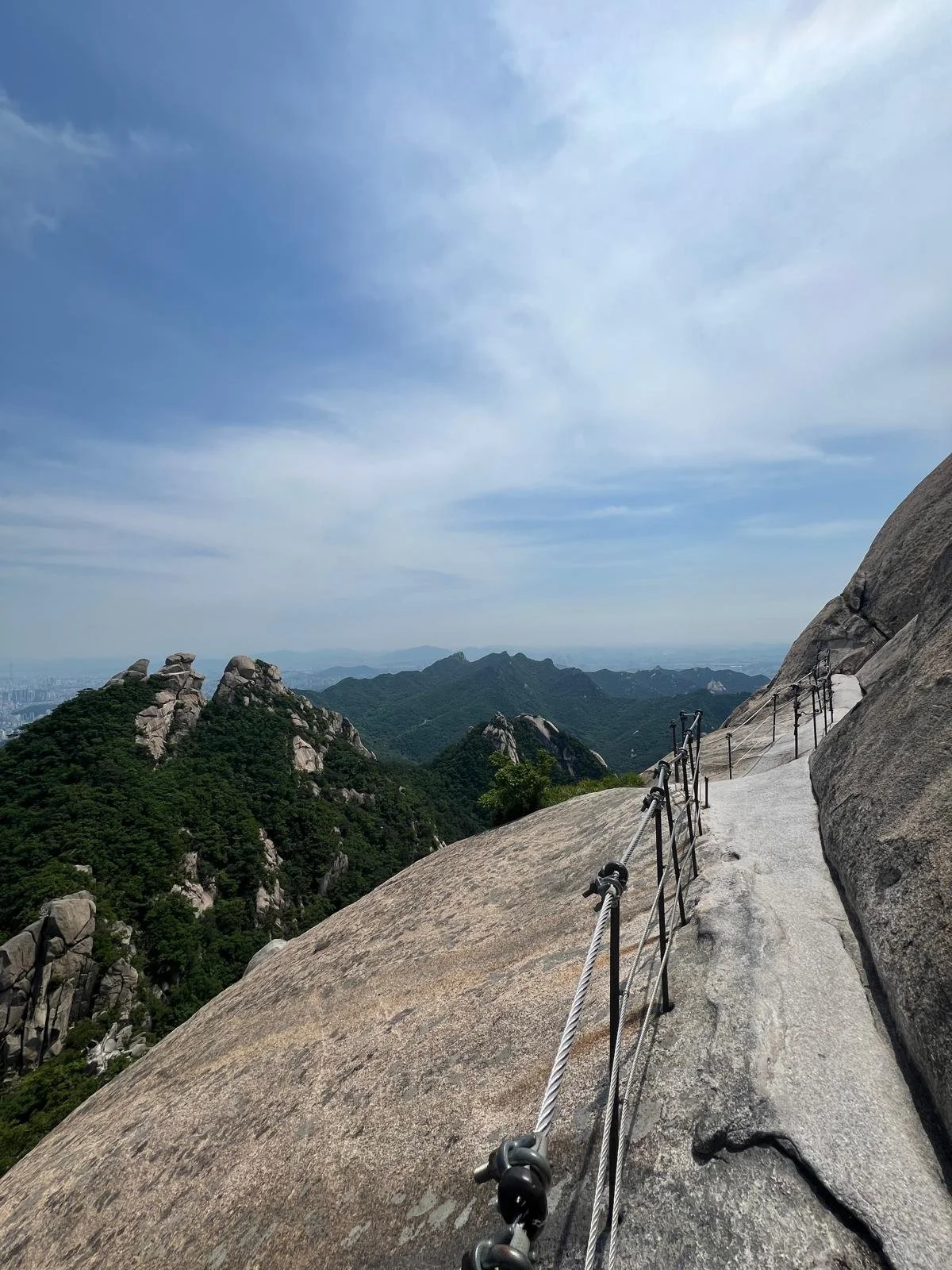 The top of the breathtaking Bukhansan national park hike, featuring trees rocks, photography opportunities and more in Seoul, South Korea