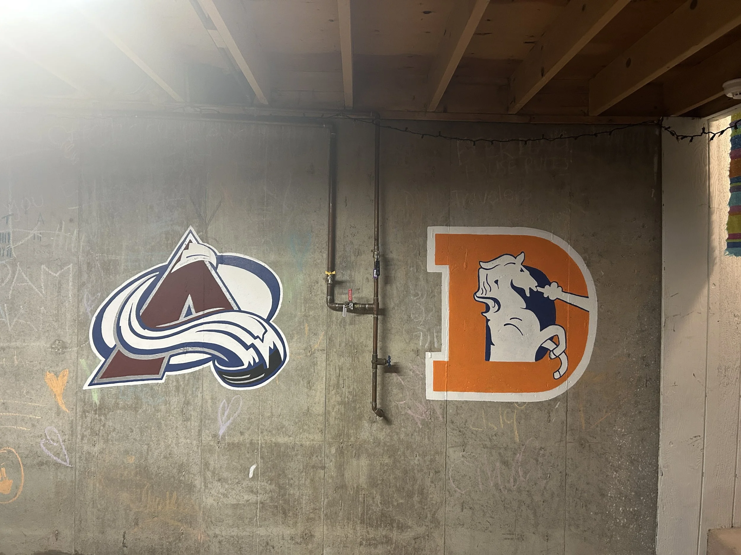 Hand Painted Avs + Broncos Logos. Acrylic paint on concrete.