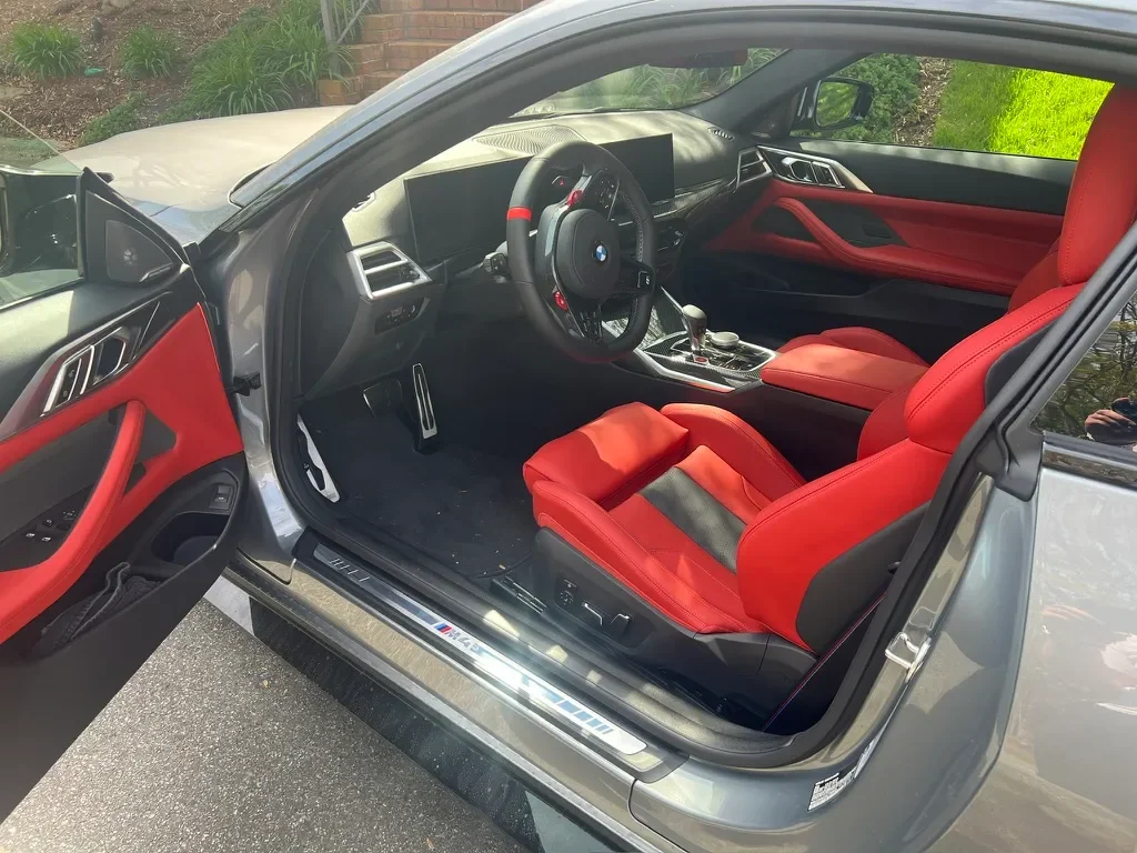 BMW M4 interior featured with the Dash Mobile Detailing Maintenance Detail package.