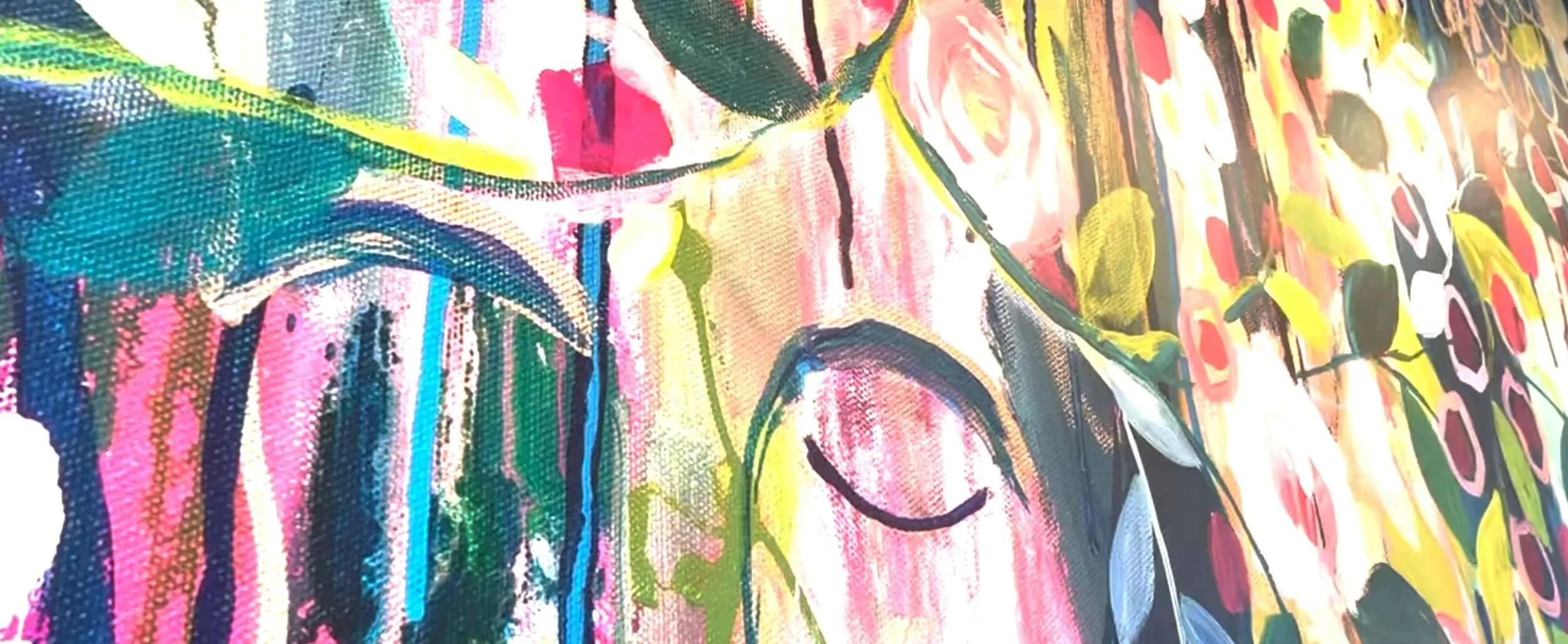 Close-up of an abstract, colorful painting with various shapes, lines, and patterns in bright colors such as pink, yellow, green, and blue.