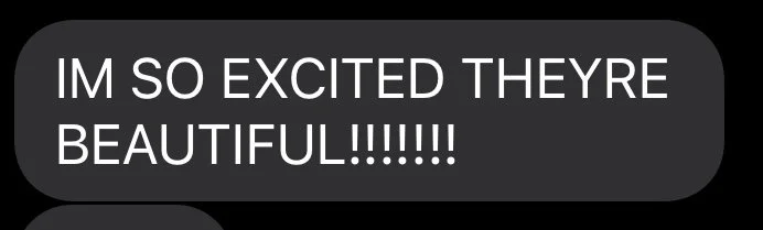 A text message bubble with the words "IM SO EXCITED THEY'RE BEAUTIFUL!!!!!!" in capital letters.