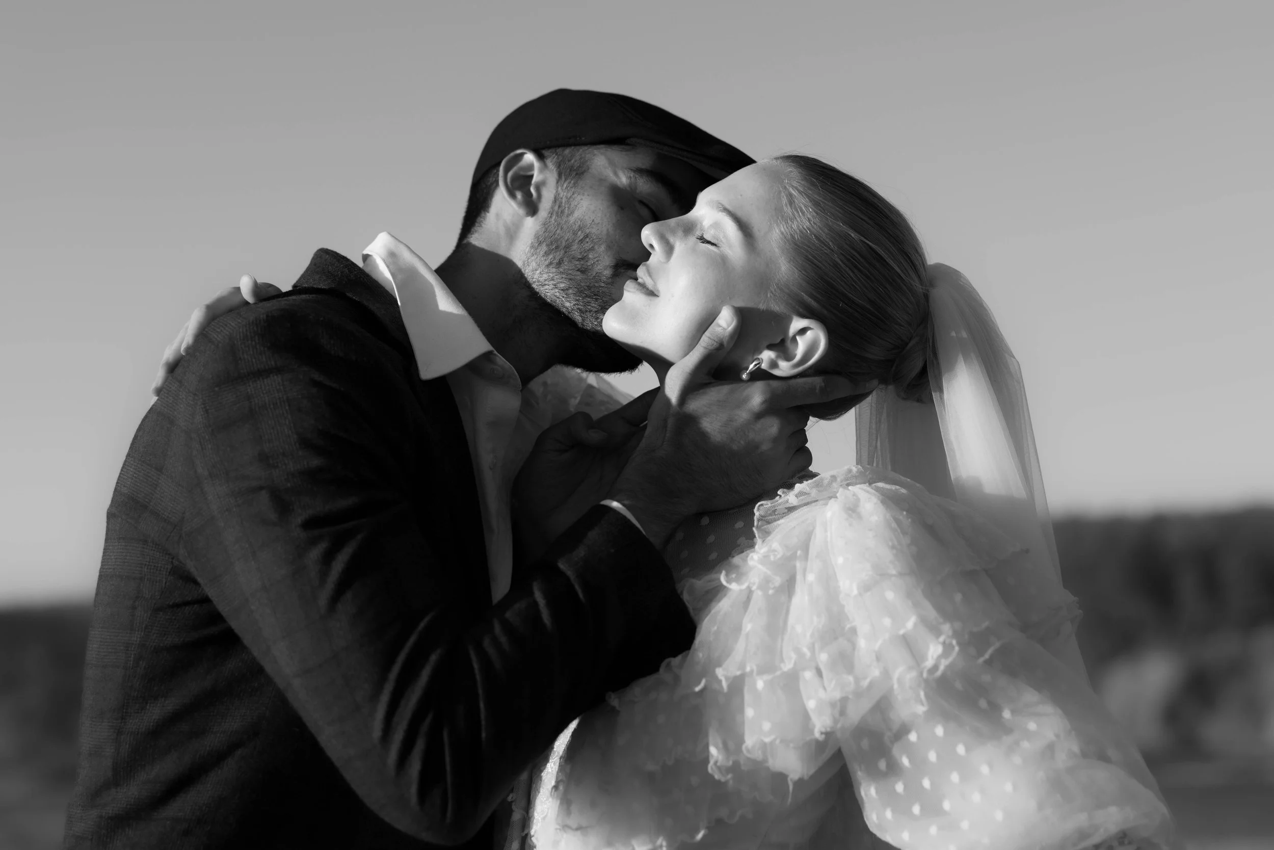 Black and white wedding portrait of a couple kissing during an intimate elopement captured by California photographer Kirstin Mullins.