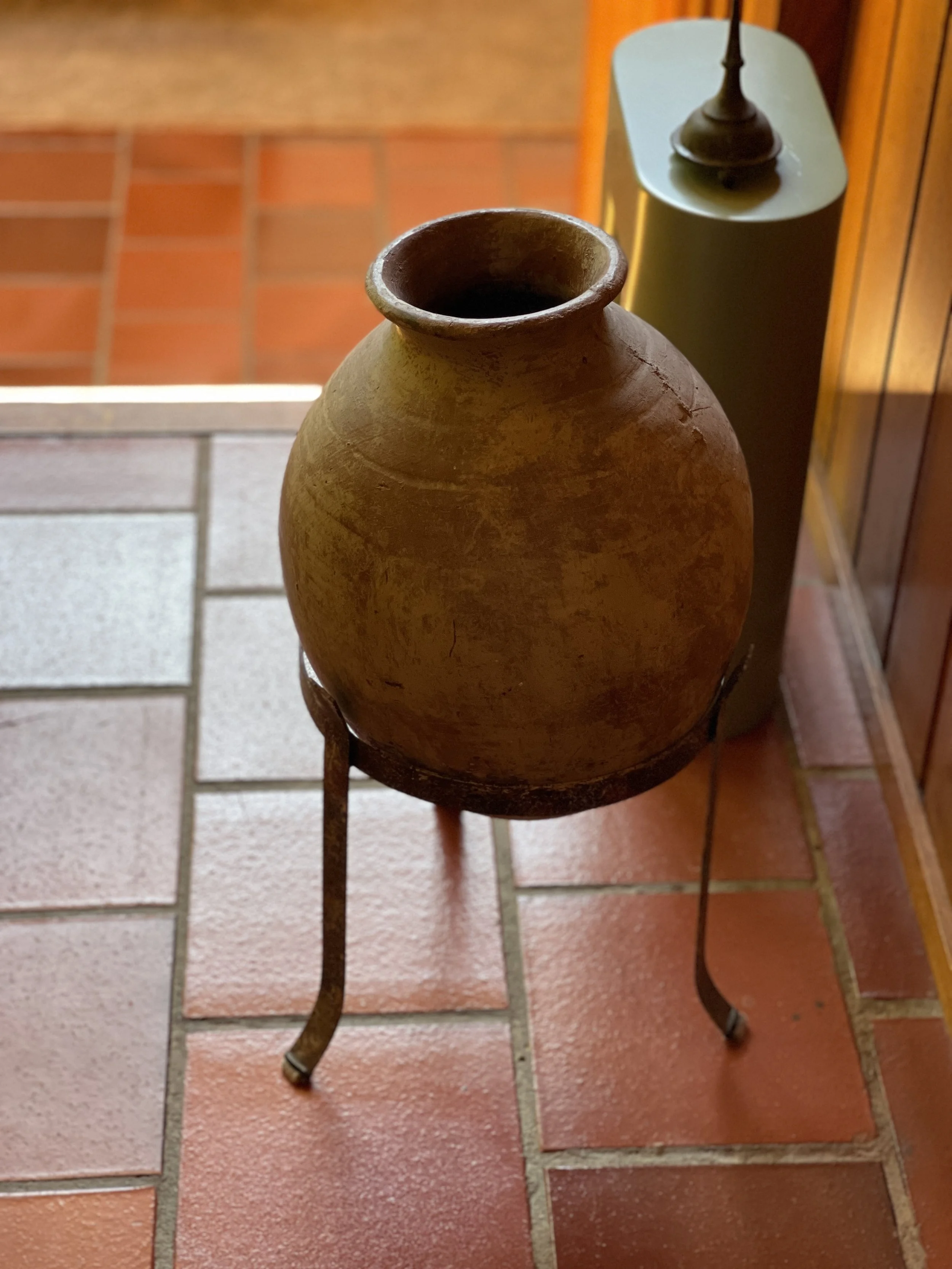 earthenware pot on metal stand