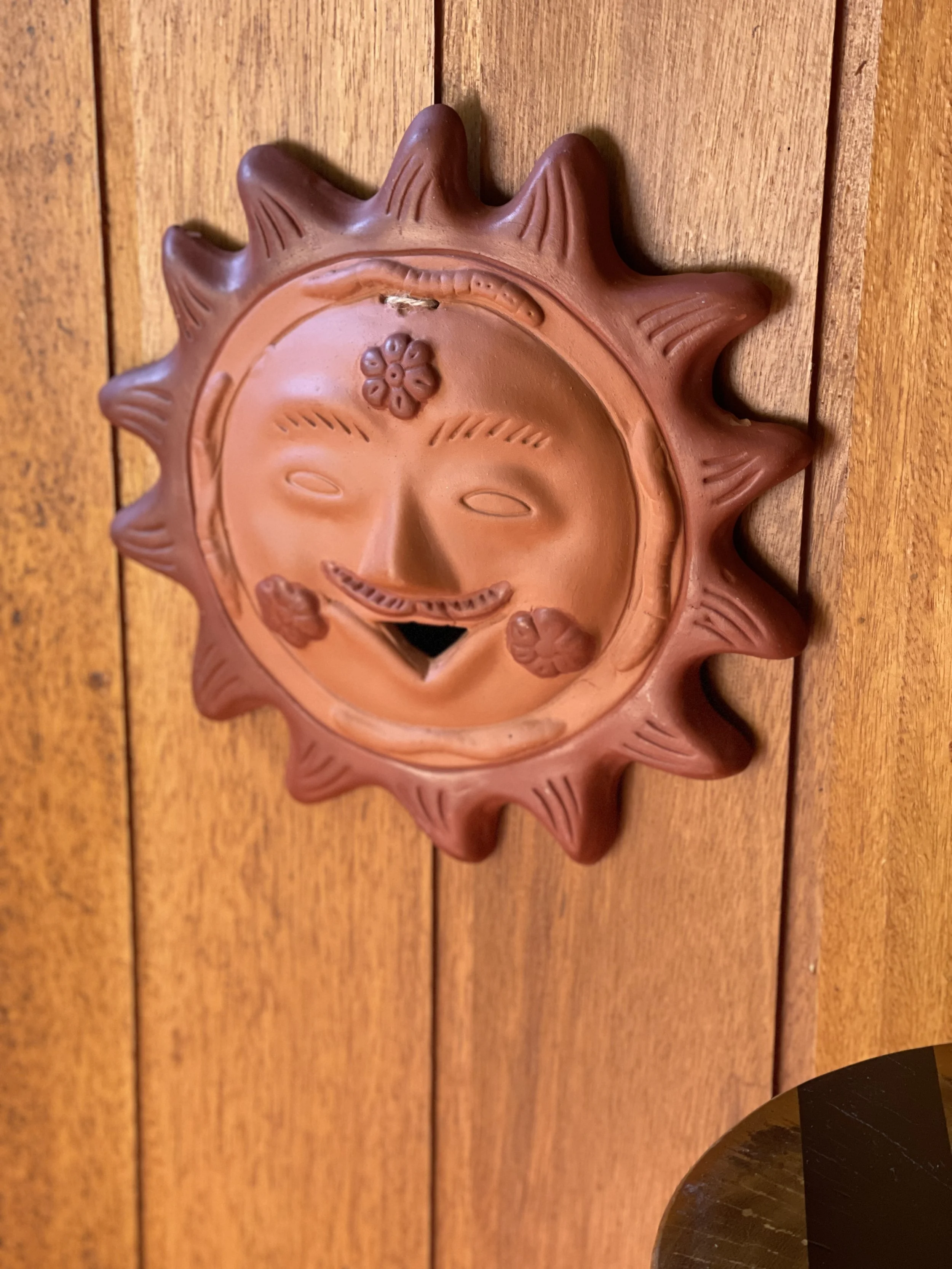 vintage folk art terracotta sun wall hanging