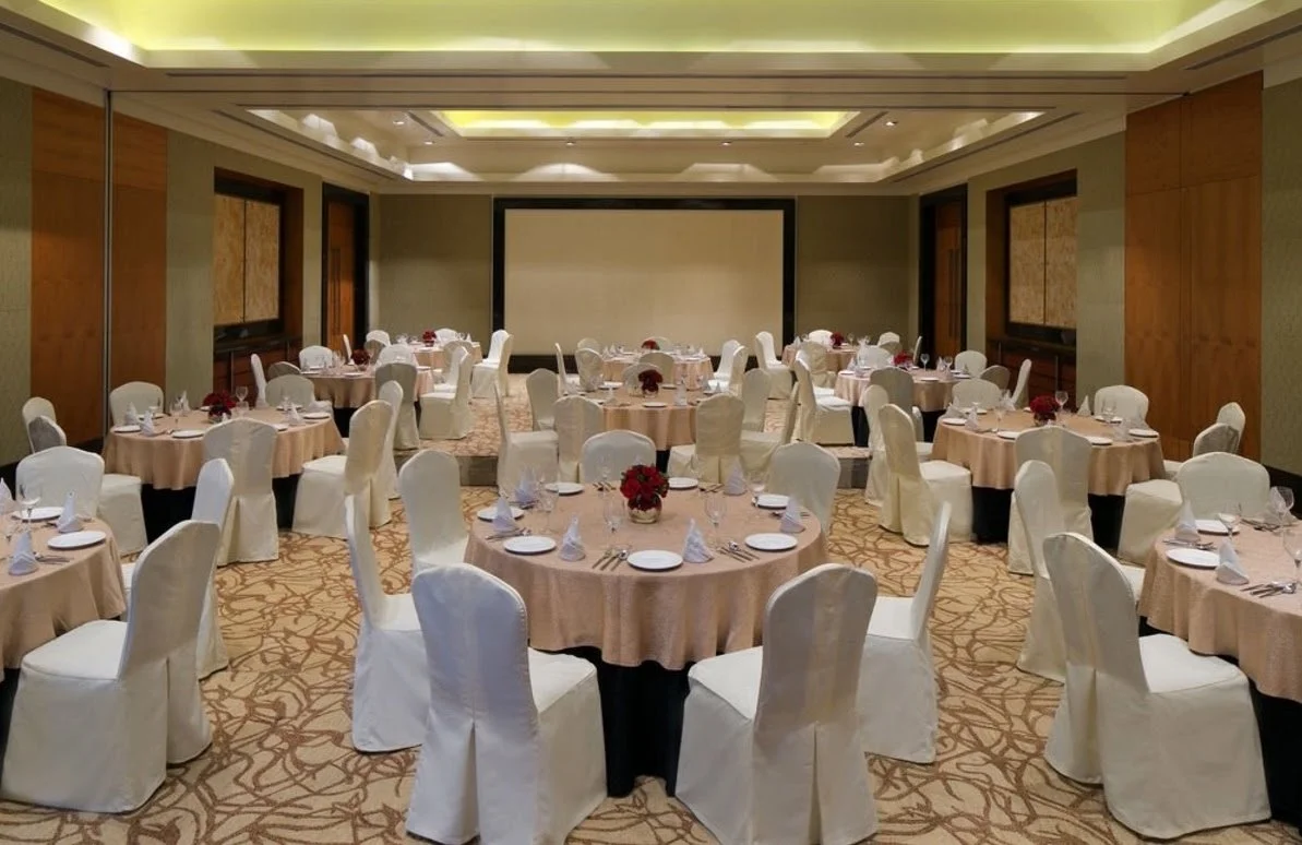 Banquet hall with round tables at Radisson Blu Resort Alibaug