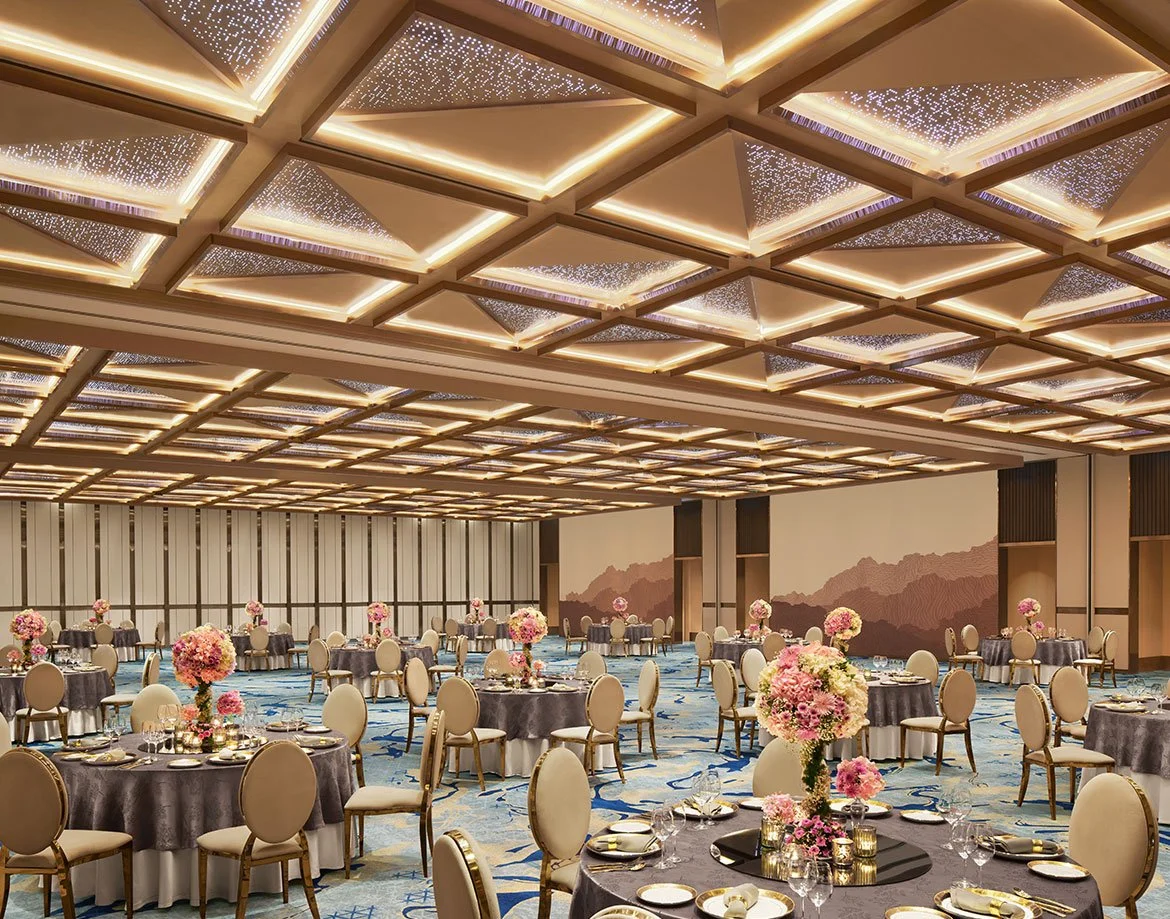 Ballroom set with round tables at JW Marriott Mumbai Juhu