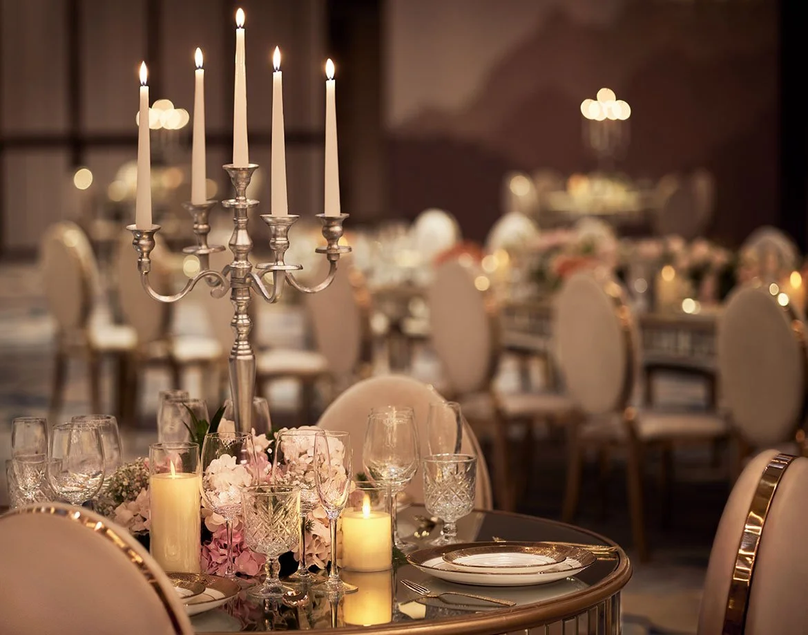 Candelabra and place settings at a JW Marriott Juhu reception