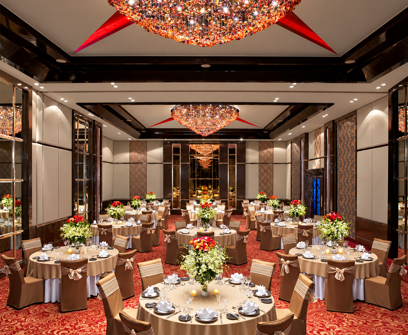 Red and gold ballroom with chandeliers at Sofitel Mumbai BKC