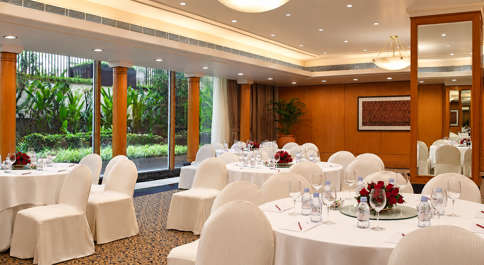 Private dining room set with white chairs at The Oberoi Mumbai