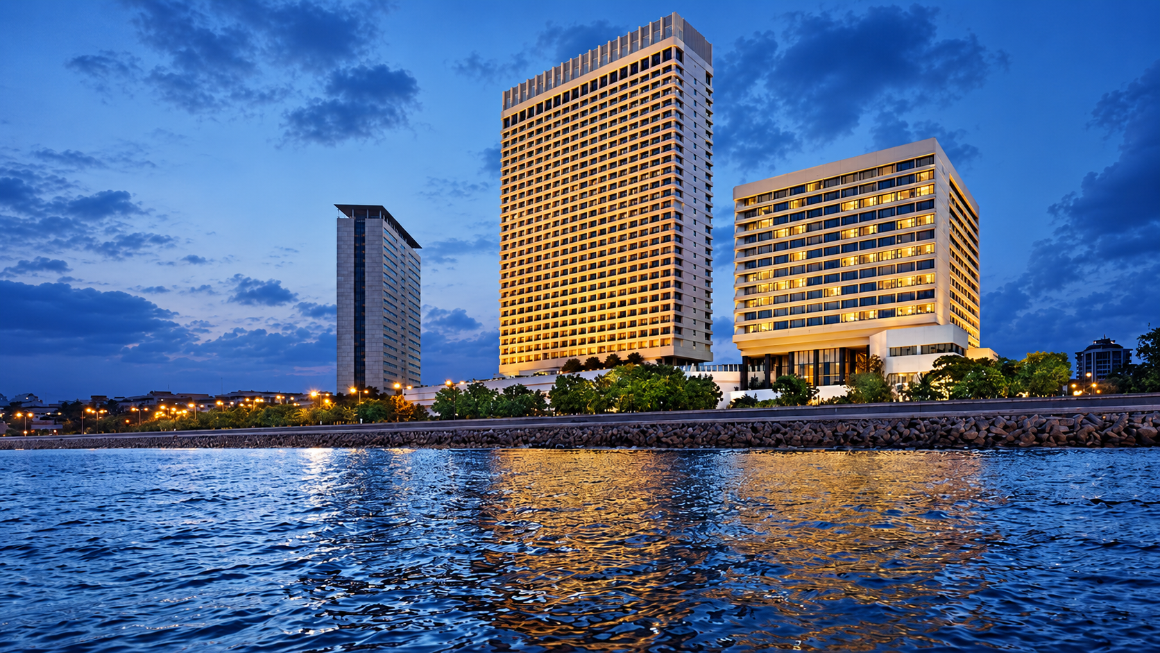 The Oberoi and Trident towers reflected in the bay at night