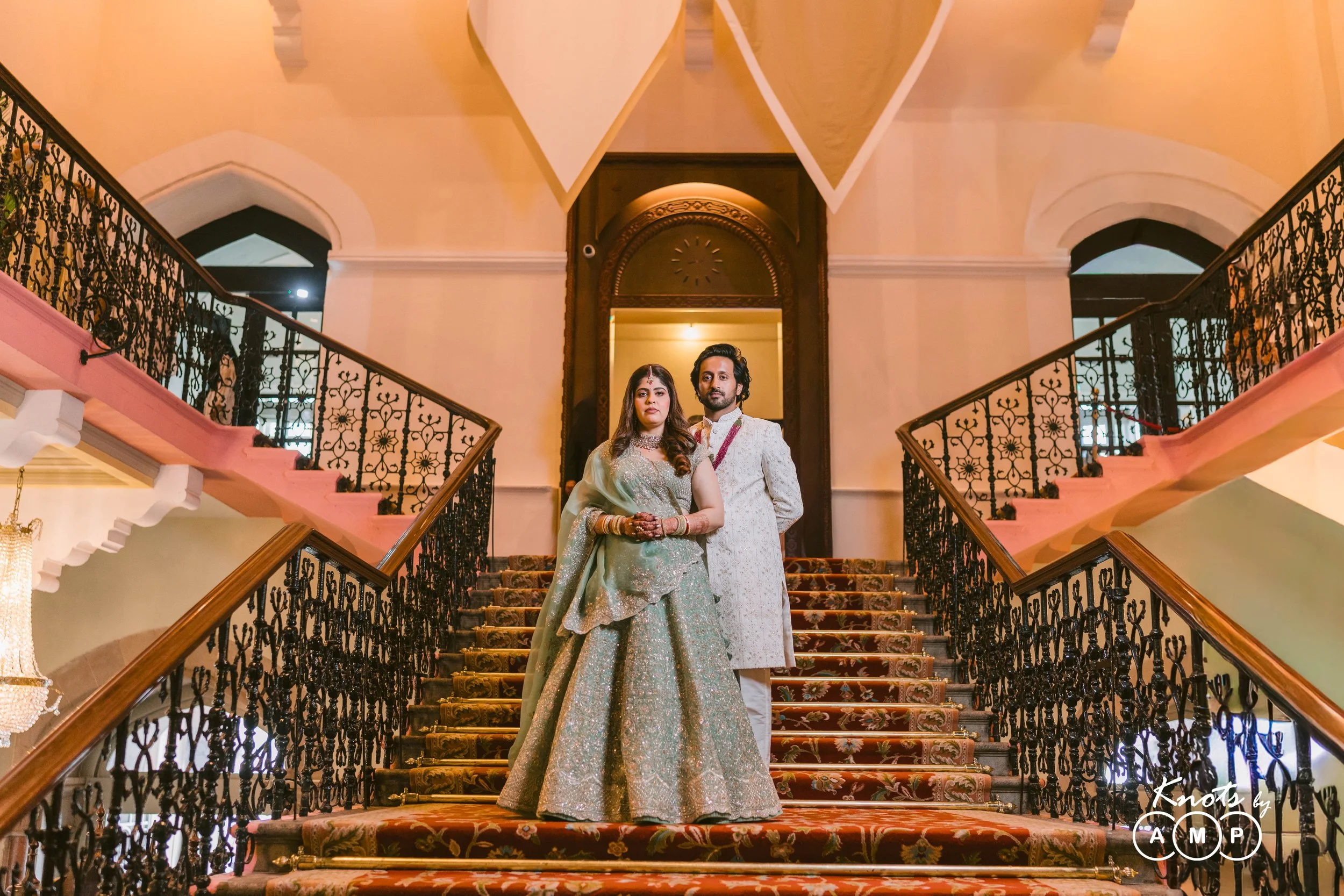 Couple on the grand staircase at The Taj Mahal Palace Mumbai
