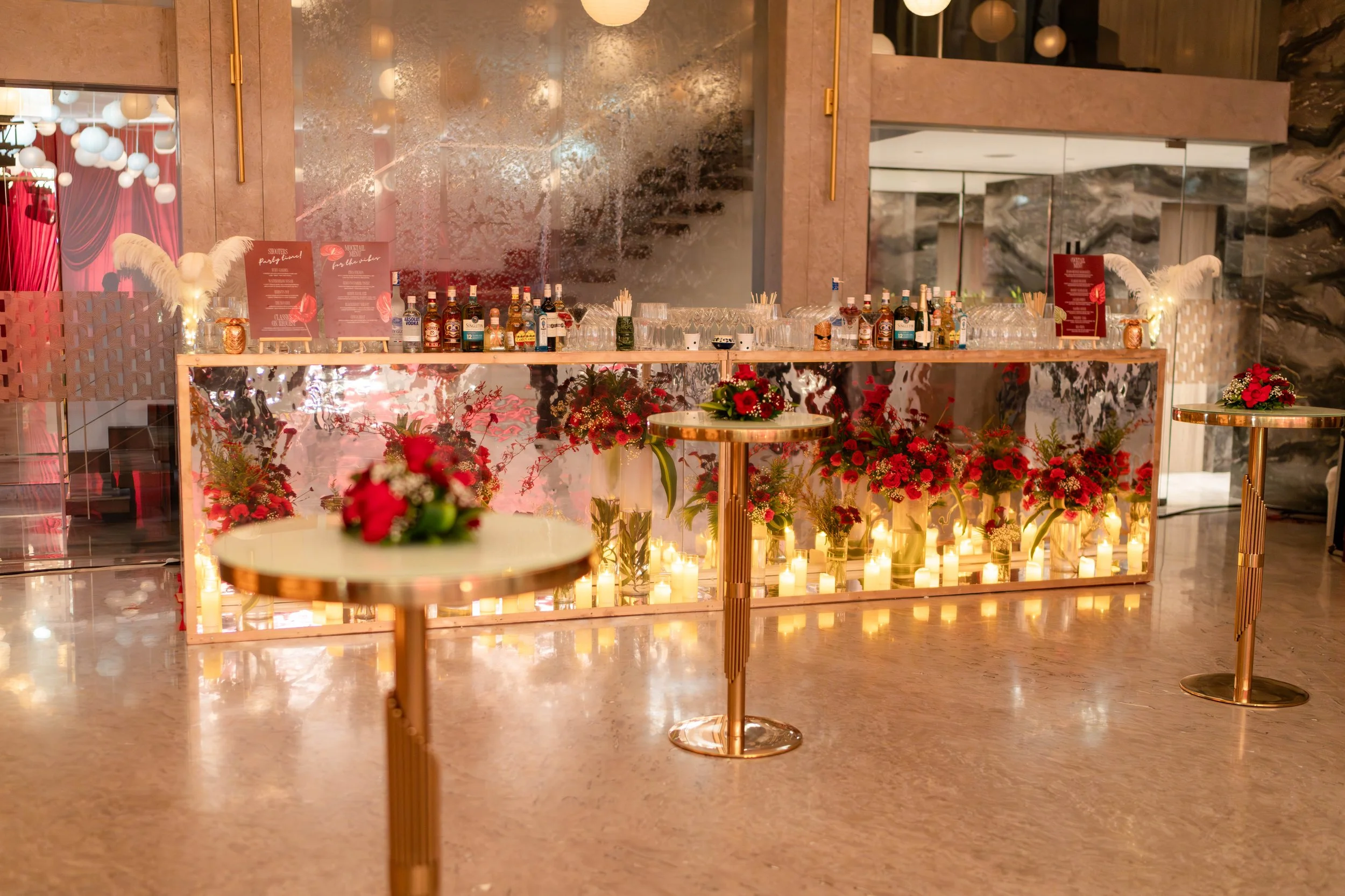 Mirrored bar with candles and red roses at Blue Sea Banquets