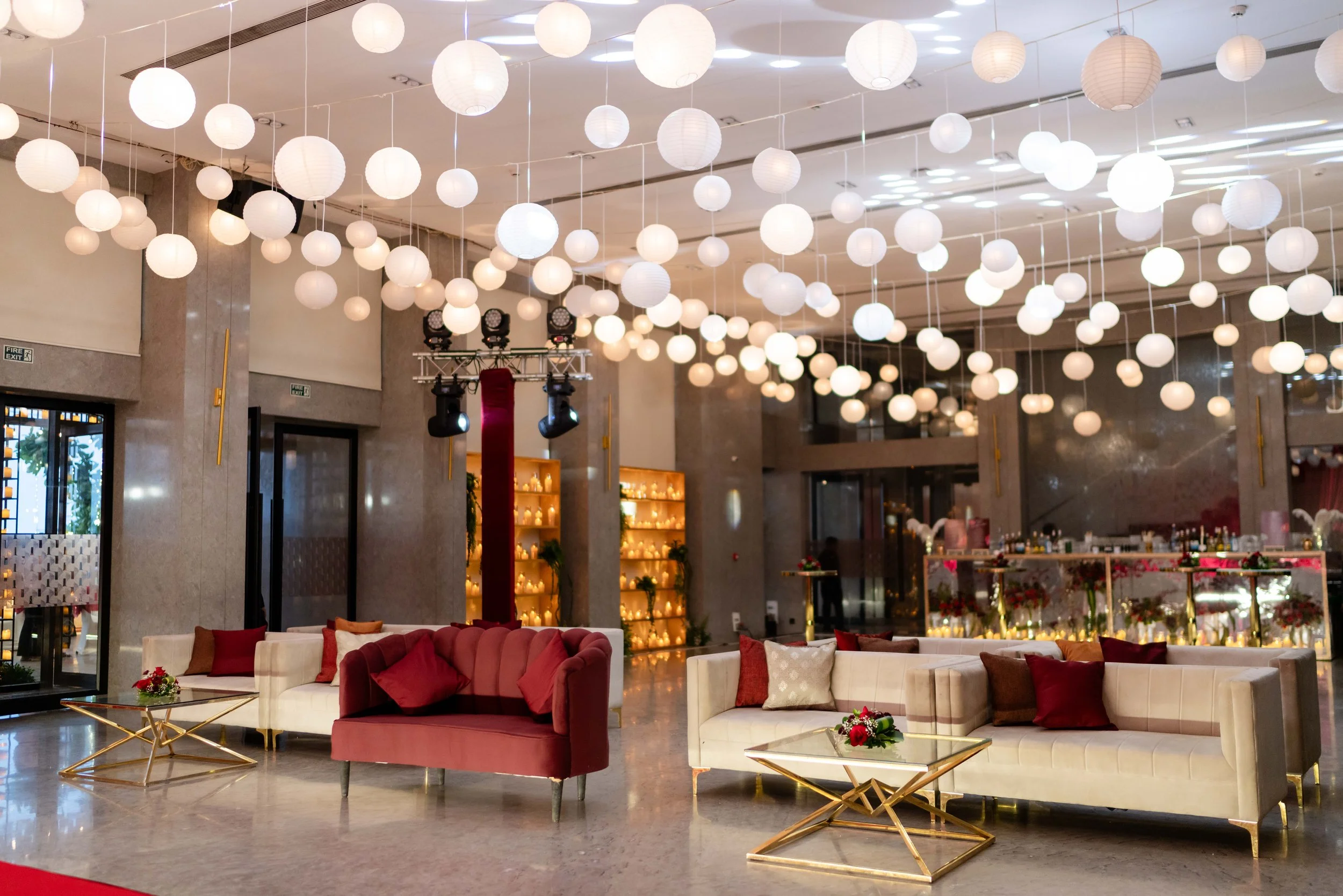 Lounge with paper lanterns overhead at Blue Sea Banquets