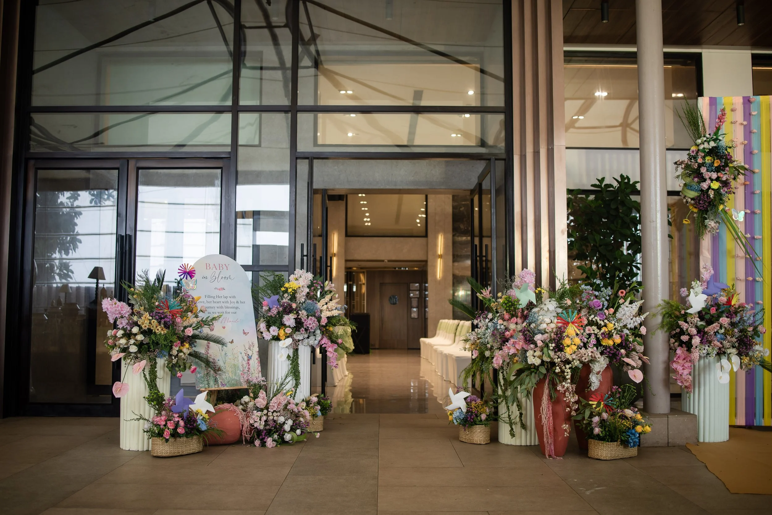 Floral entrance with tall arrangements at Blue Sea Banquets