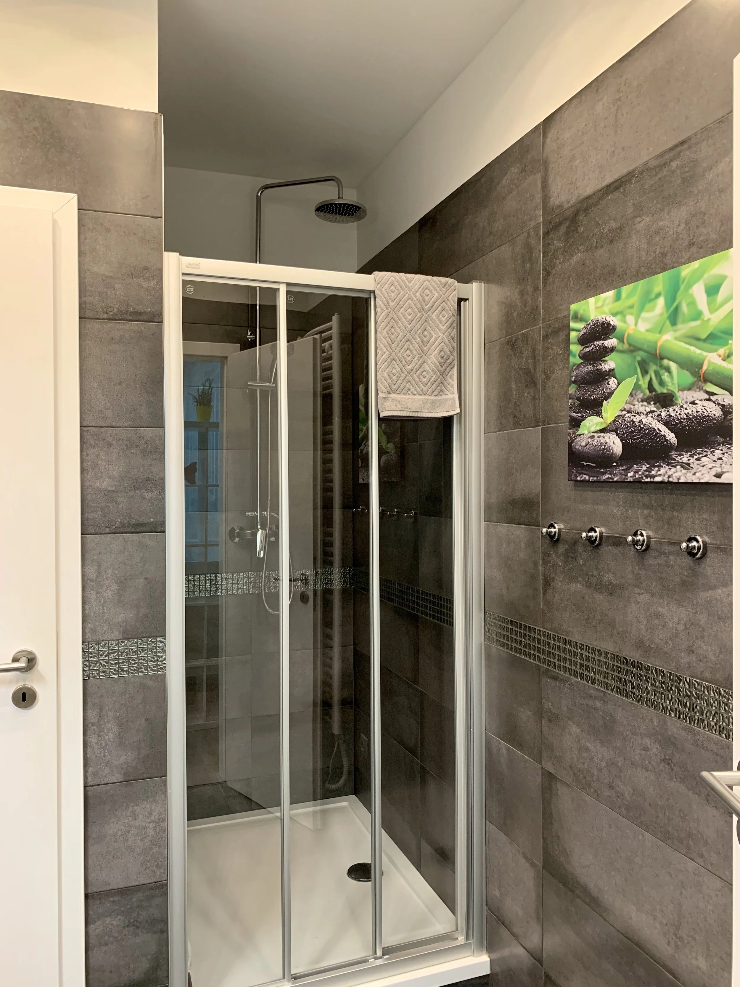 shower with hangers on the wall