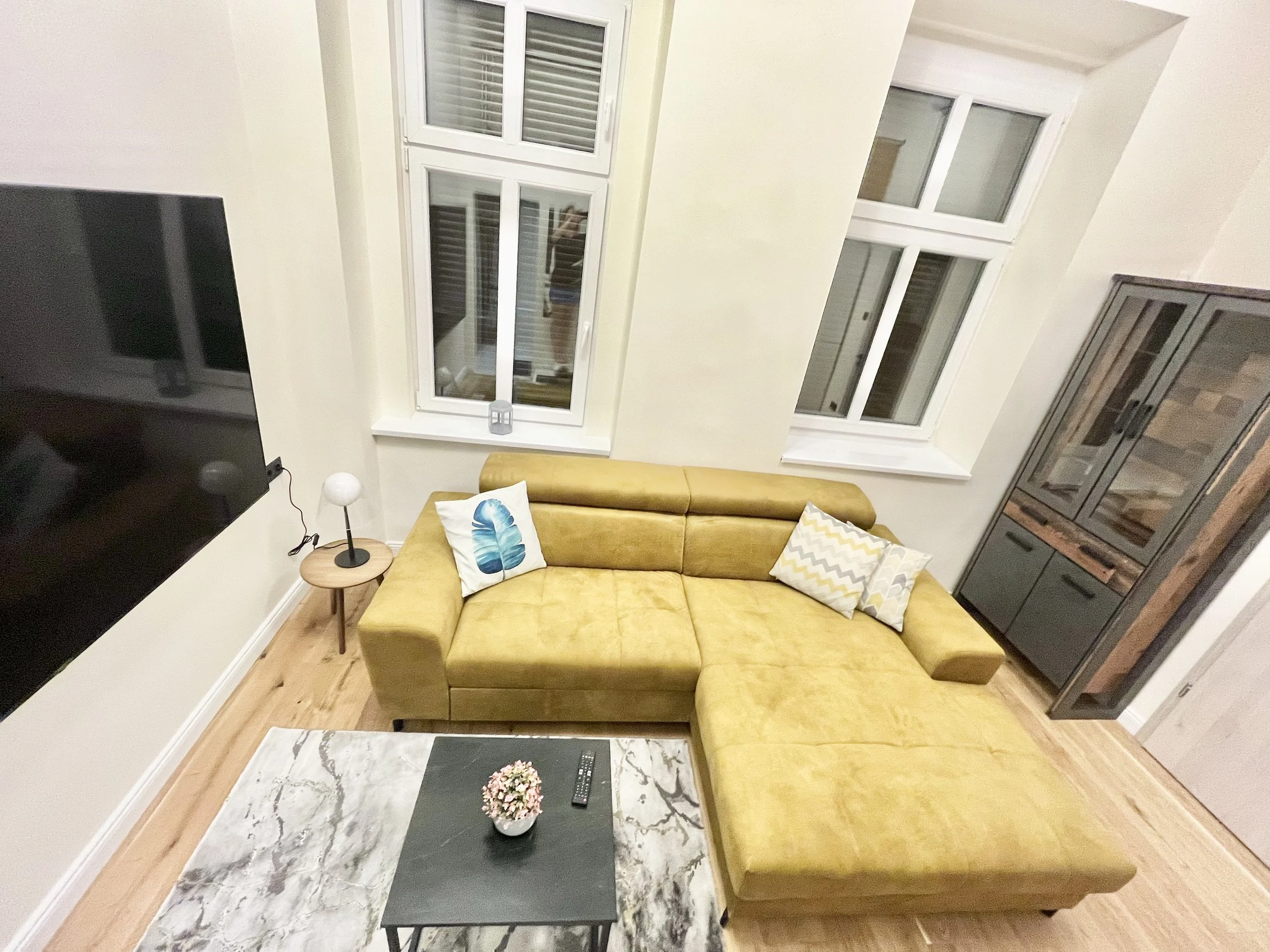 Room with big sofa and TV