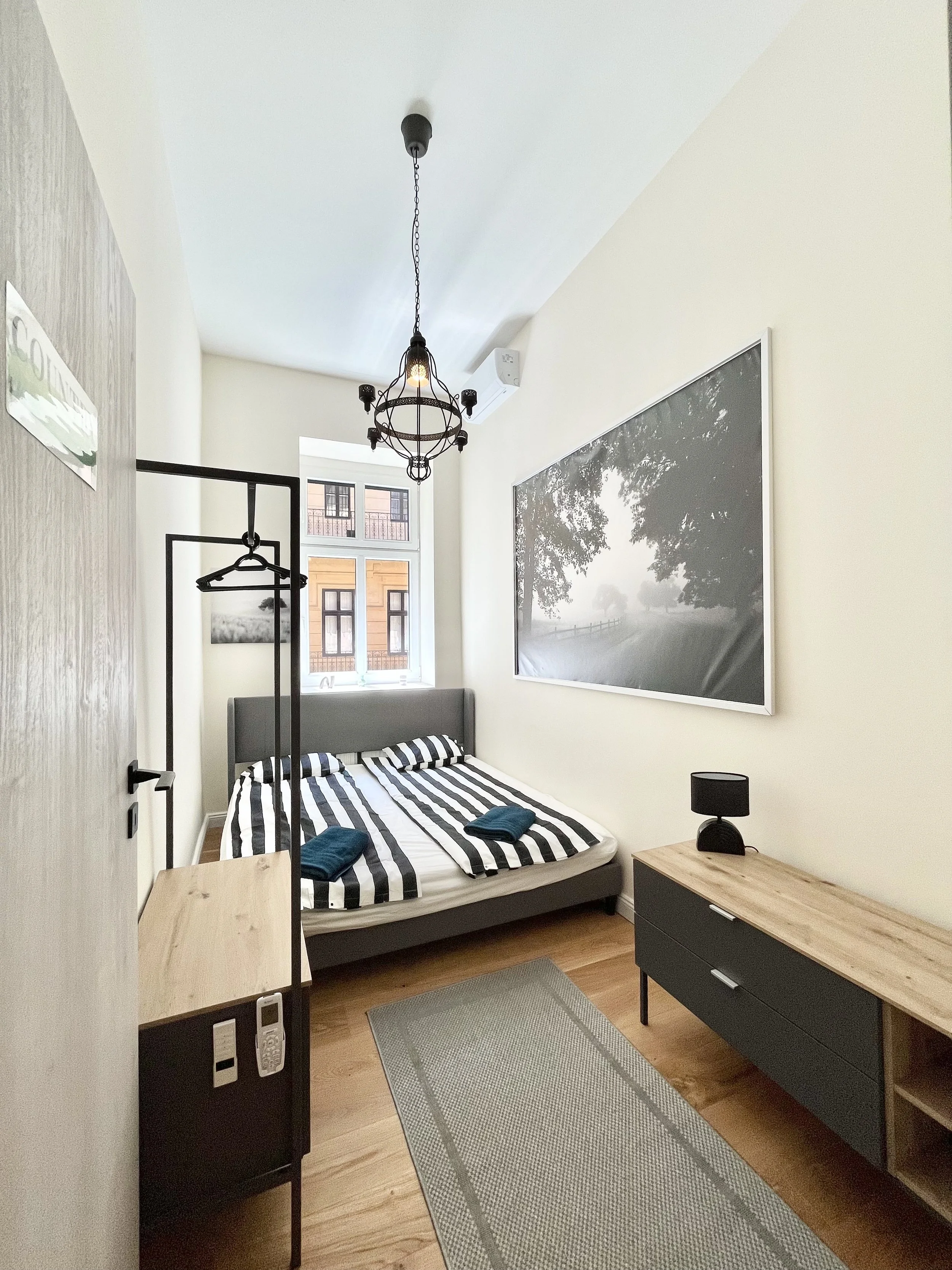 Bedroom with big bed and storage options