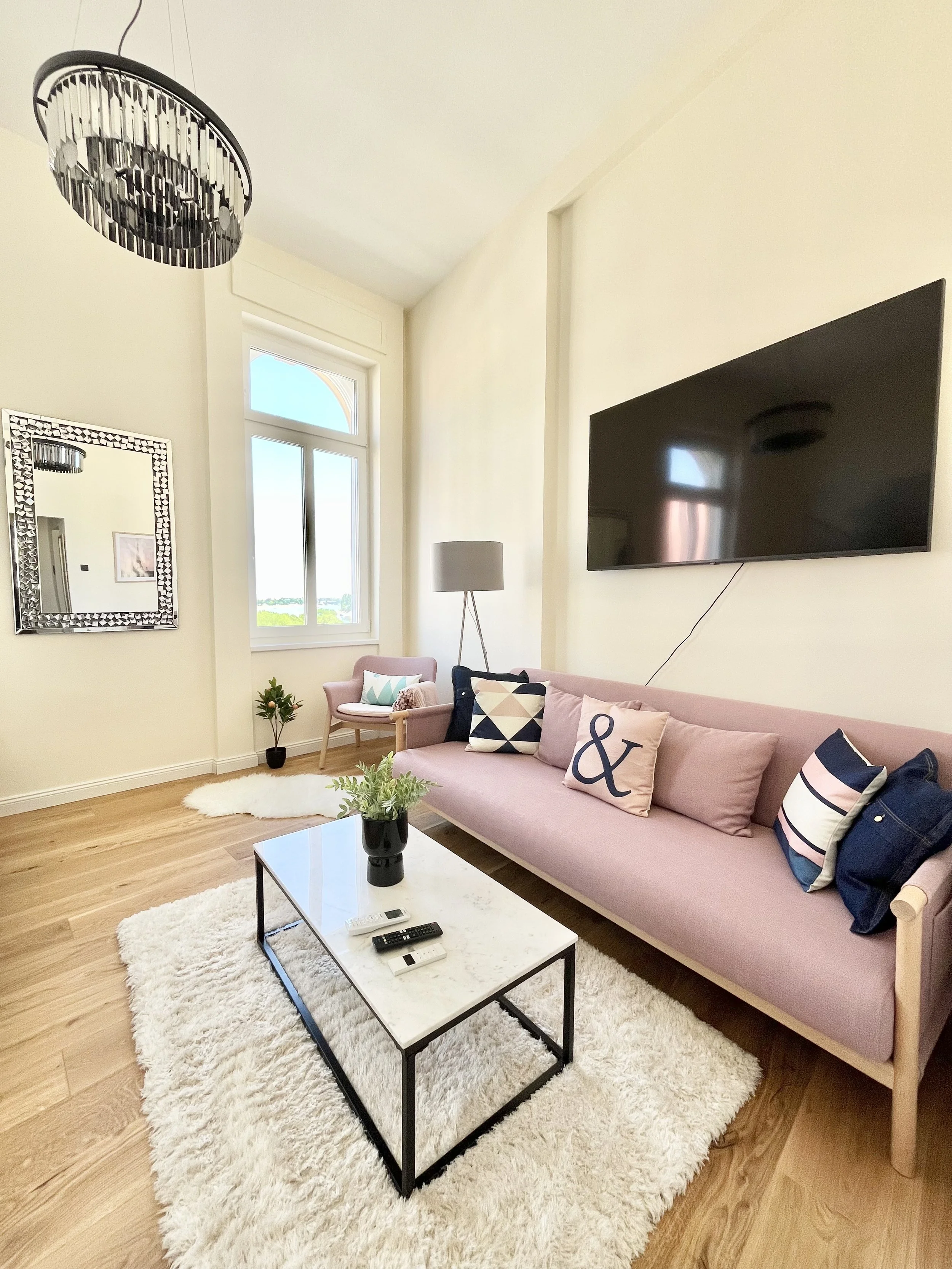 Bedroom with sofa and TV