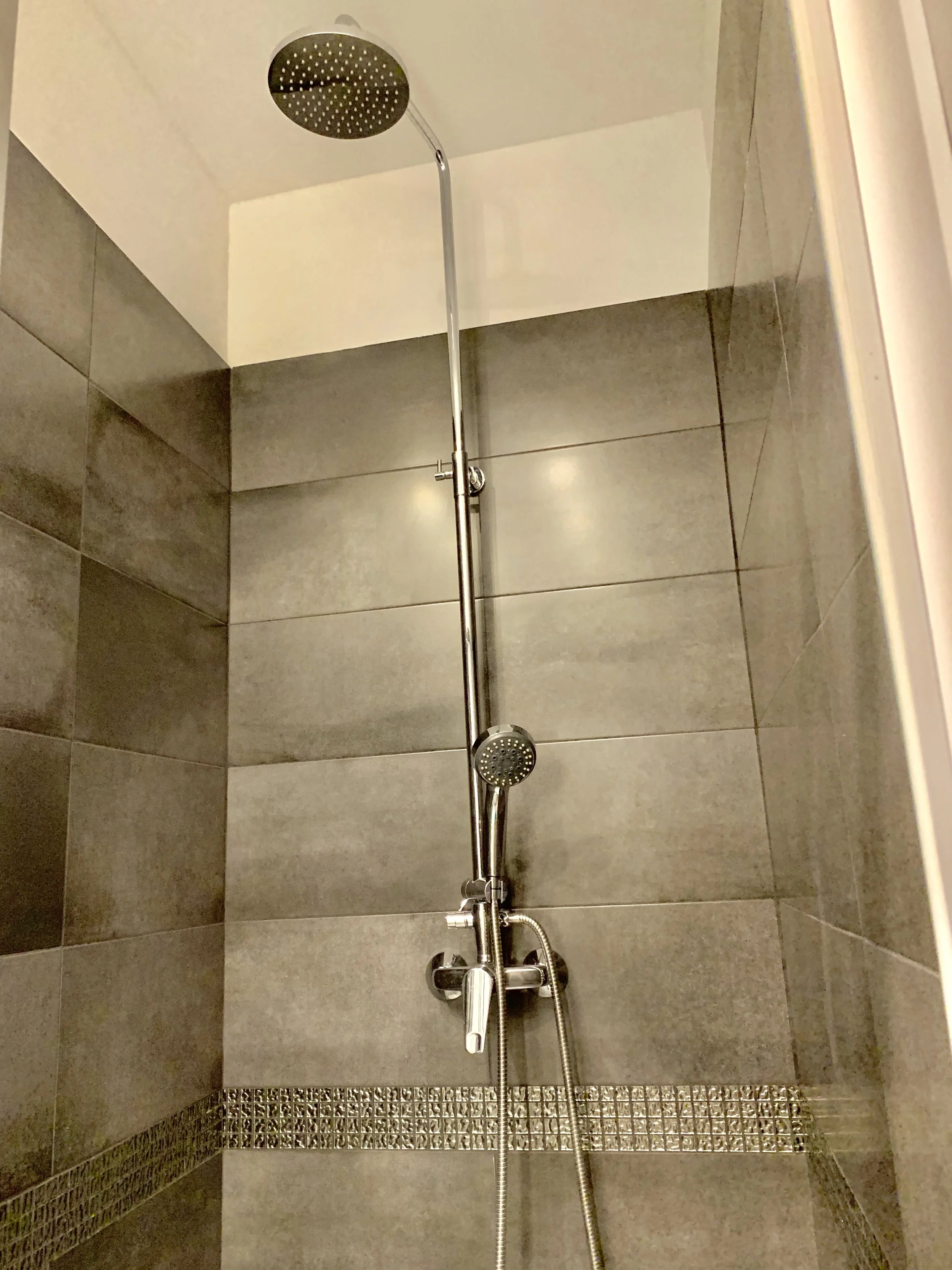 shower with grey tiles