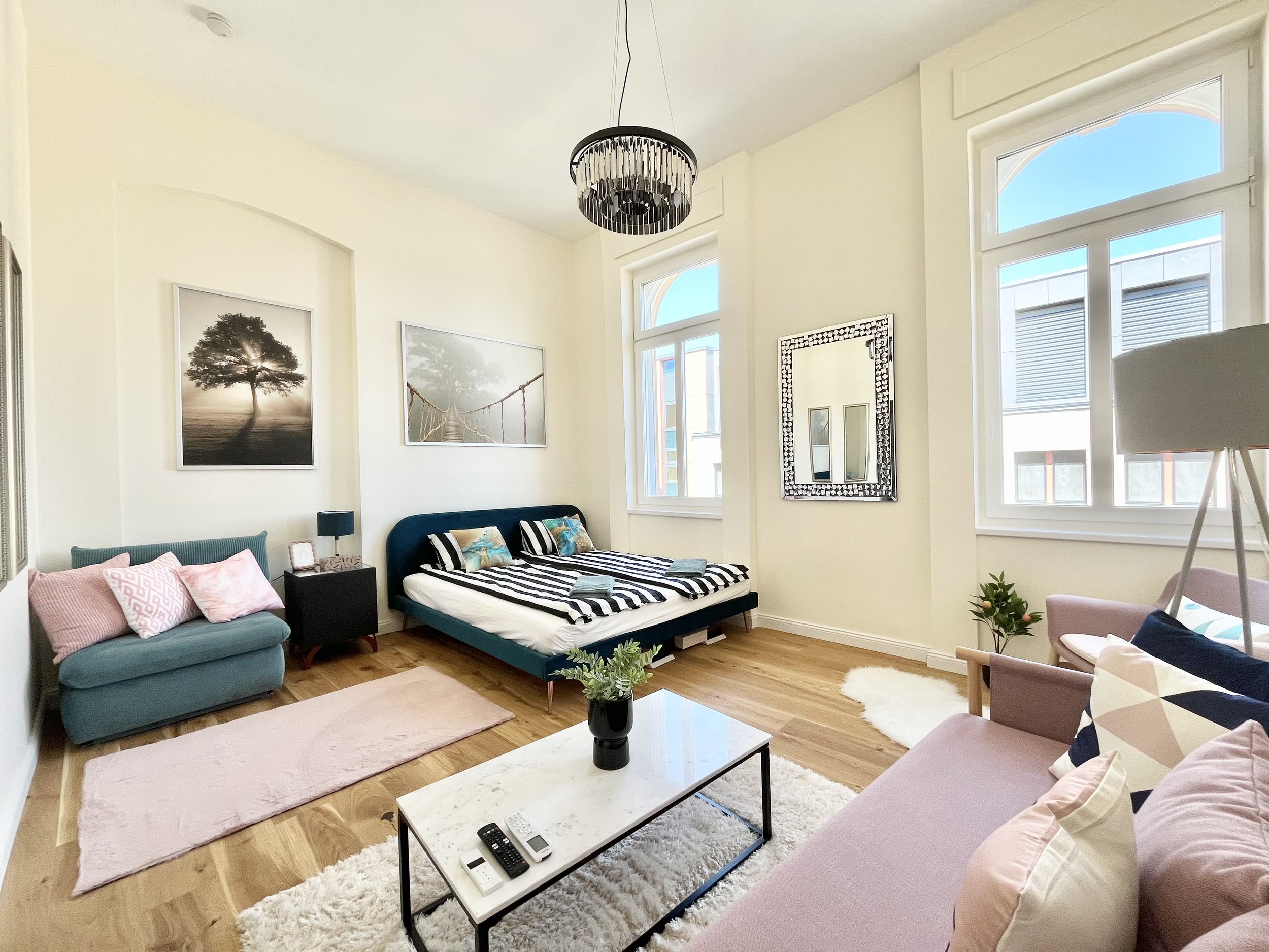 Bedroom with large windows and sofa