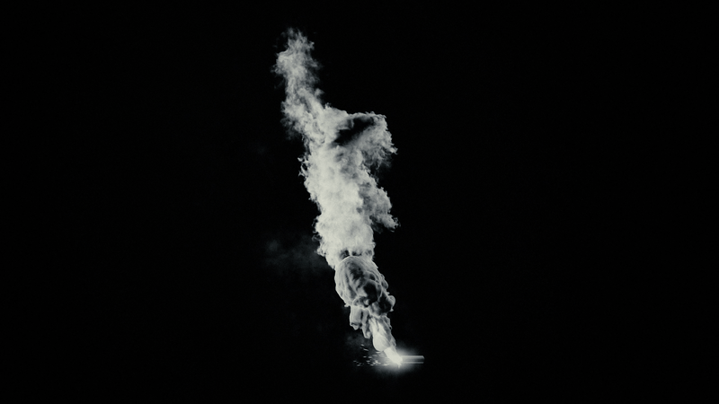 A large explosion with a bright flash and thick smoke rising into the dark sky.