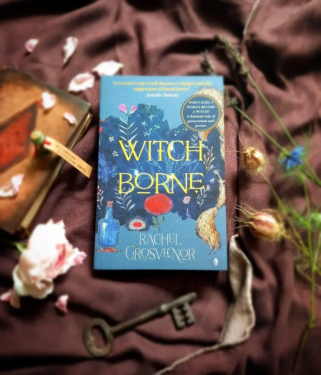 Very exciting bookmail arrived today from @rachelgrosvenorauthor and @flyonthewallpress 💙 This is a dark historical, feminist fantasy, and I can't wait! Plus, look the gorgeous protective spell charm that came with it! ❤️&zwj;🔥💙

#witchborne #rach