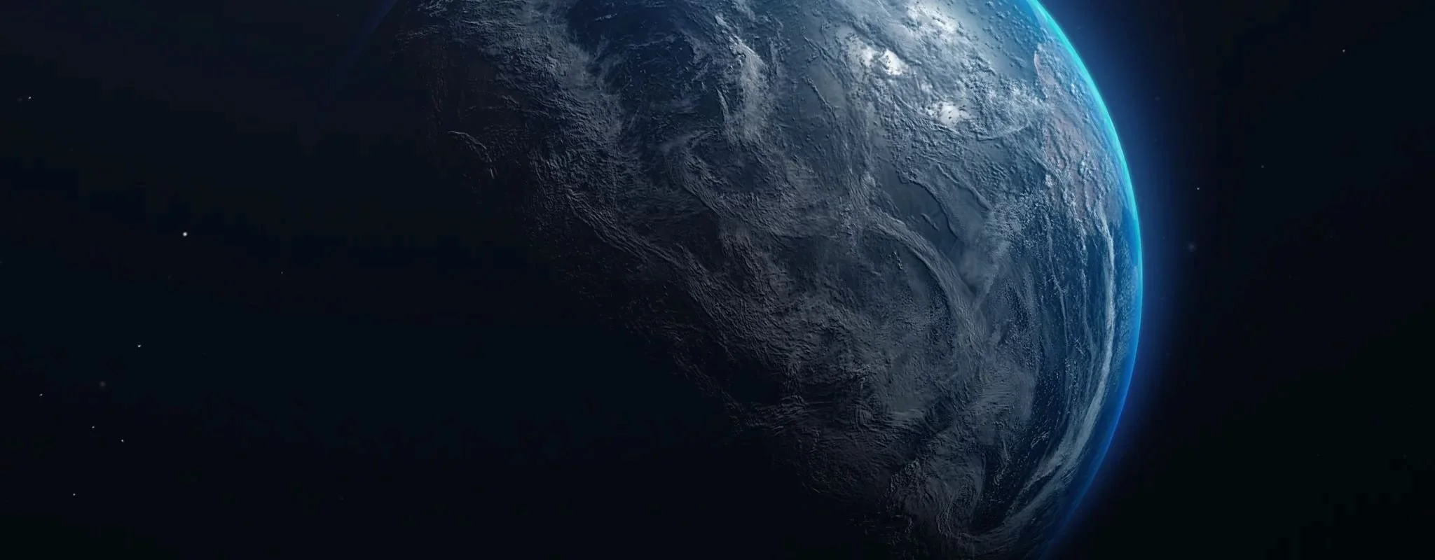 A photograph of Earth from space, showing the blue atmosphere and dark side of the planet against the blackness of space with a few distant stars.