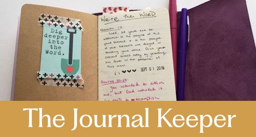 Open journal with handwritten notes and a purple pen on the right page, a decorated greeting card on the left, and a purple fabric cover partially visible. The journal is titled 'The Journal Keeper'.
