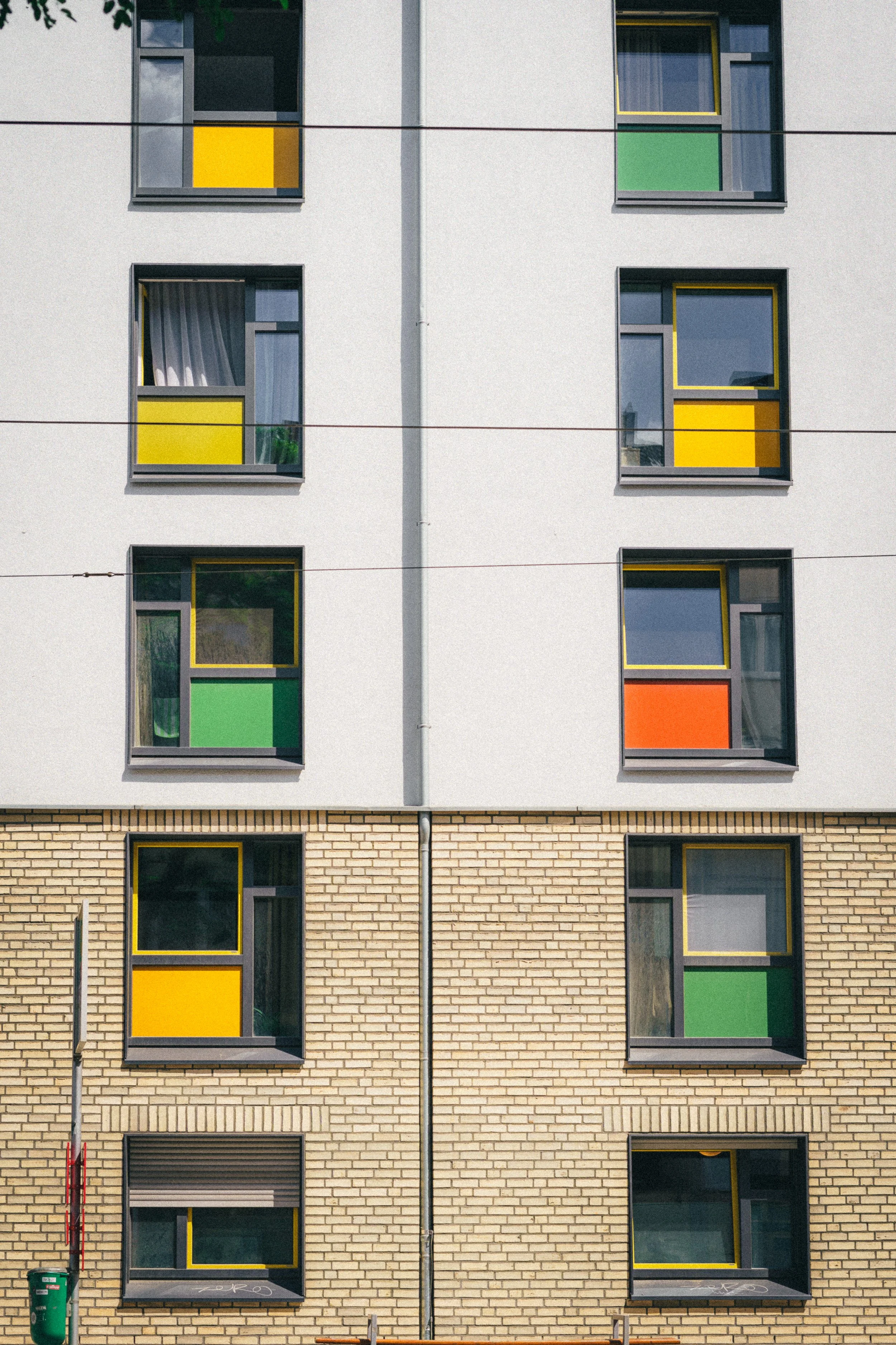 Fine art photograph of a building with many windows with many different colors. And artistic view on architecture photography.