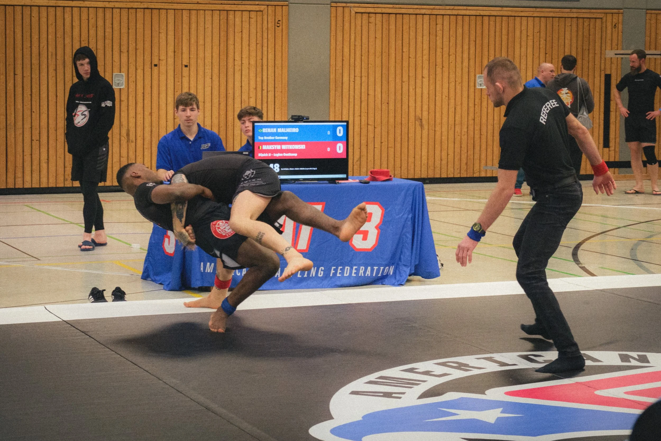 Portrait of BJJ athlete Renan Malheiro during a fight in a Brazilian Jiu-jitsu event.
