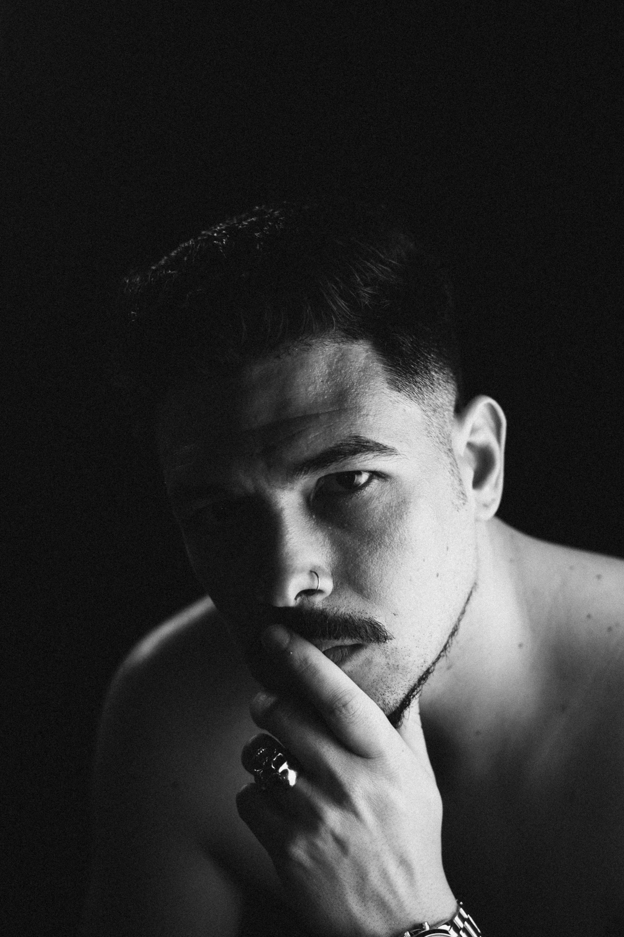 Self-portrait of João Marques in black and white, gazing directly at the camera.