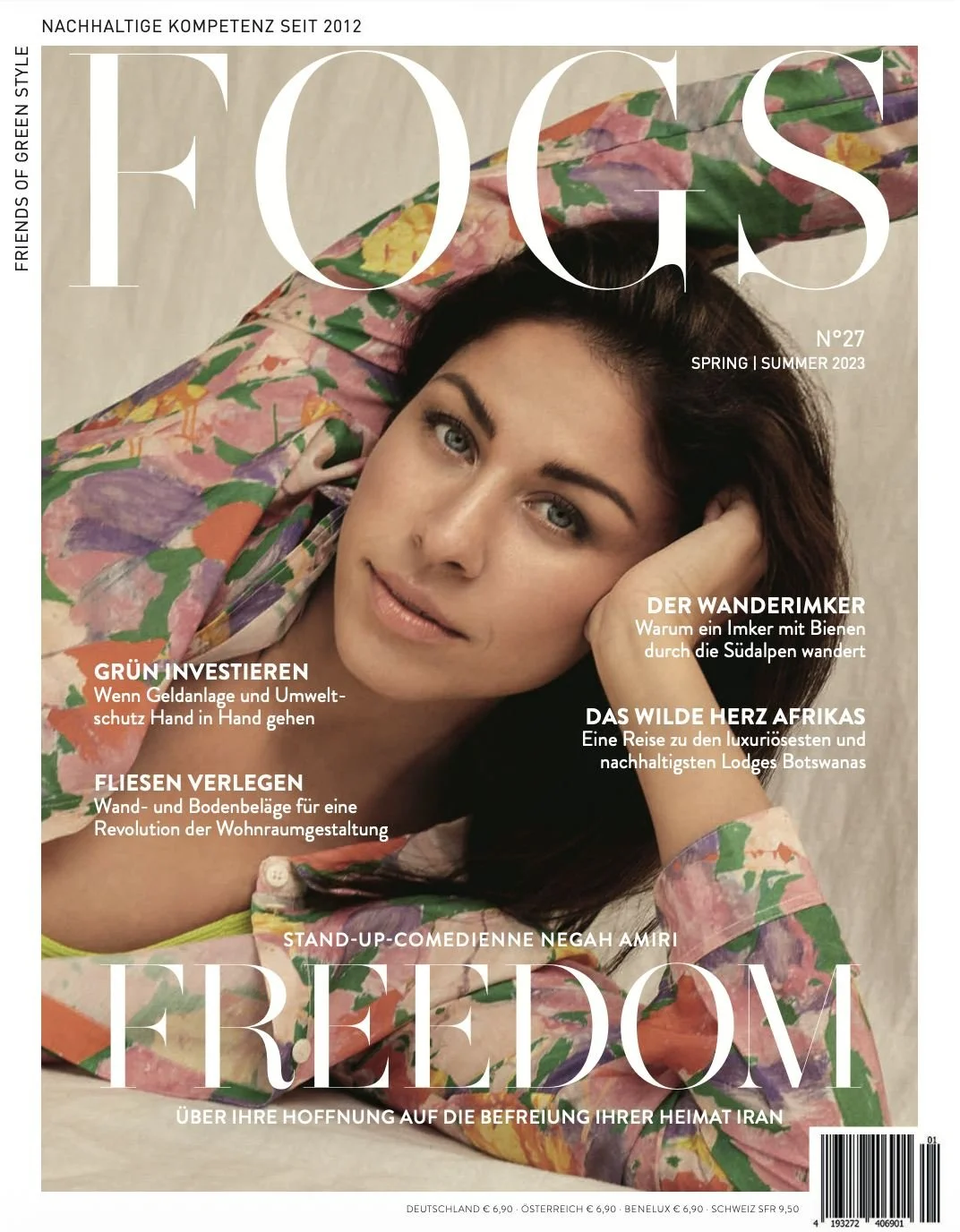 FOGS magazine cover with comedienne Negah Amiri in a colourful floral-print shirt, lying on her side