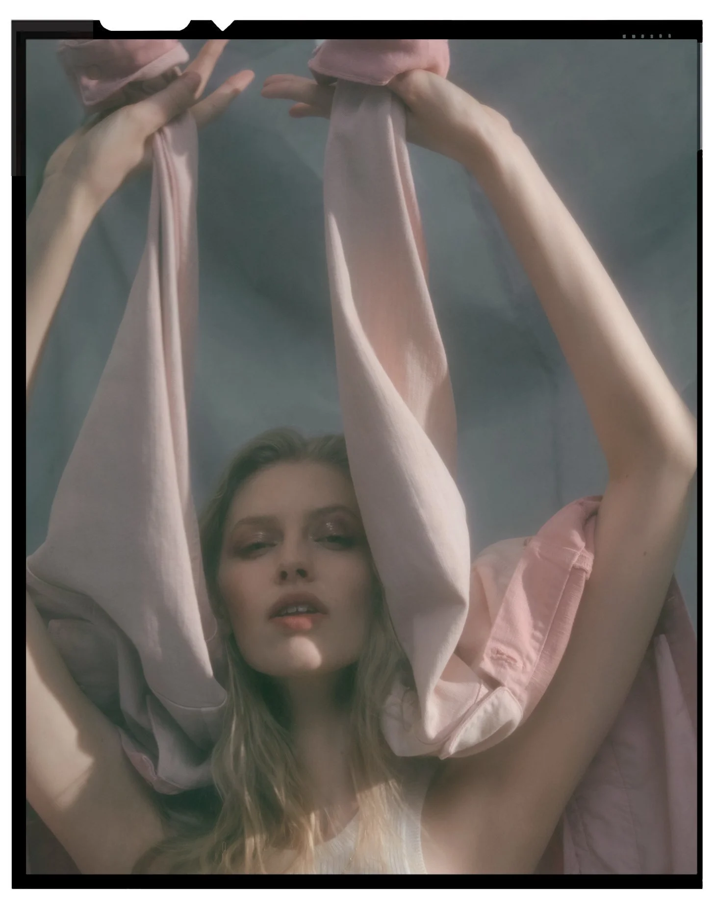 Denim editorial for Latest Magazine: pink fabric held up in front of the face