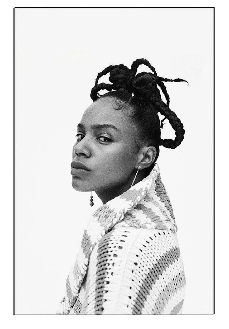 Portrait with braided hair and a knitted top, black and white