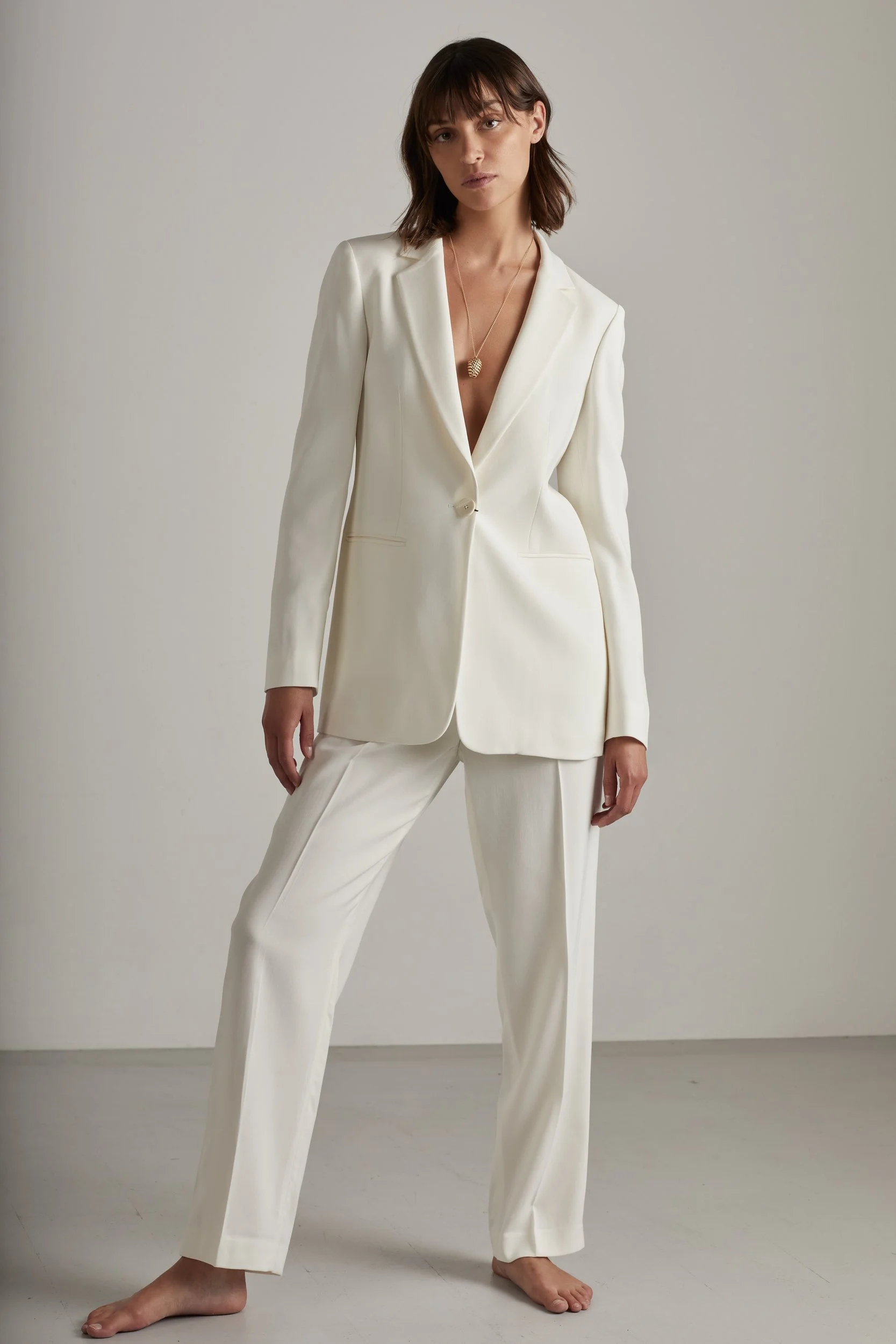 Jewellery campaign for Sian Design: white suit, standing barefoot