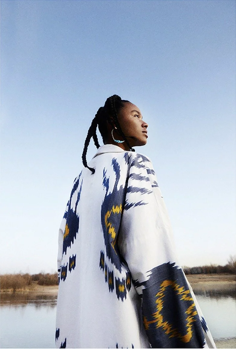 Ikat printed jacket by a lake