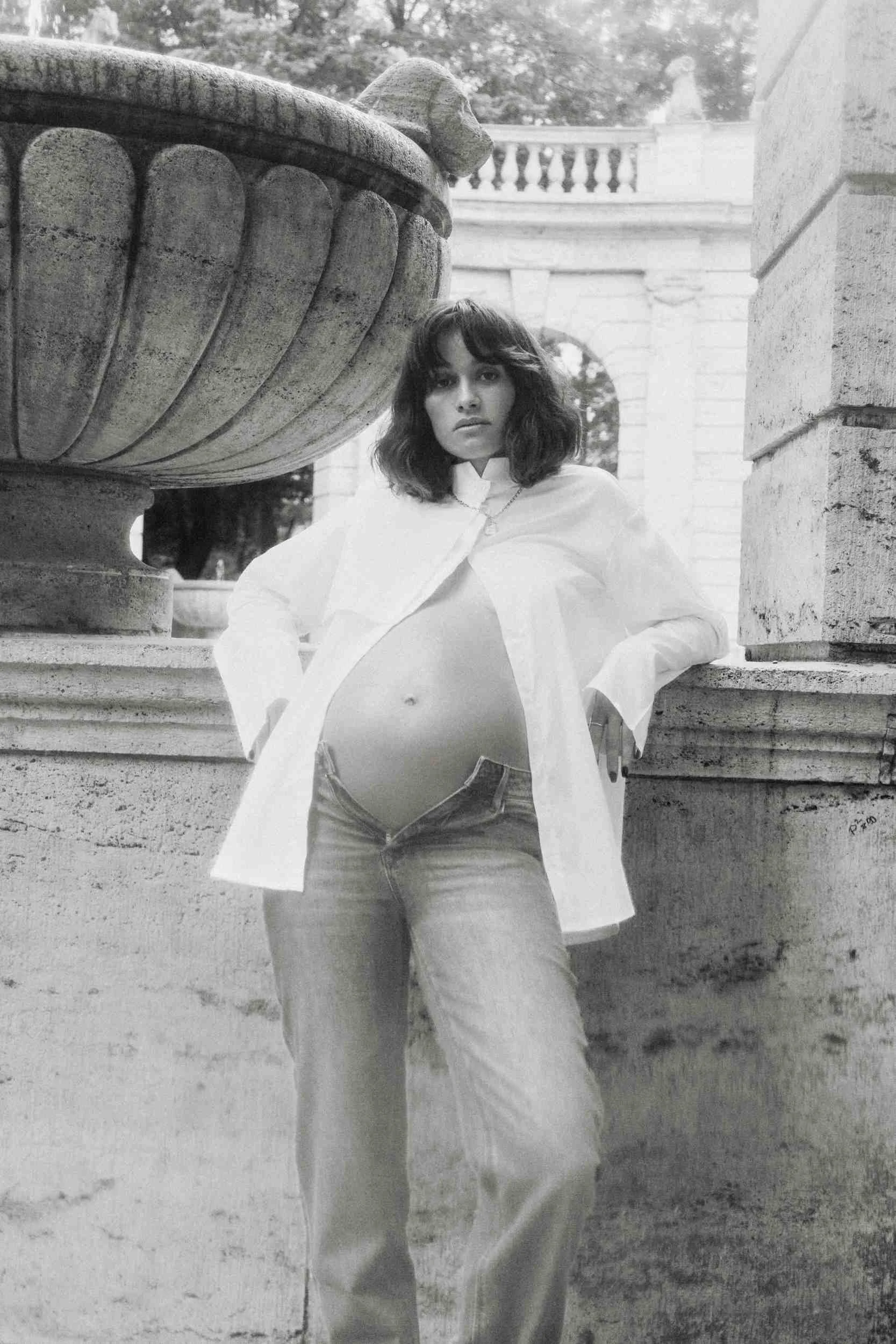 Mogli in a white shirt and jeans, black and white