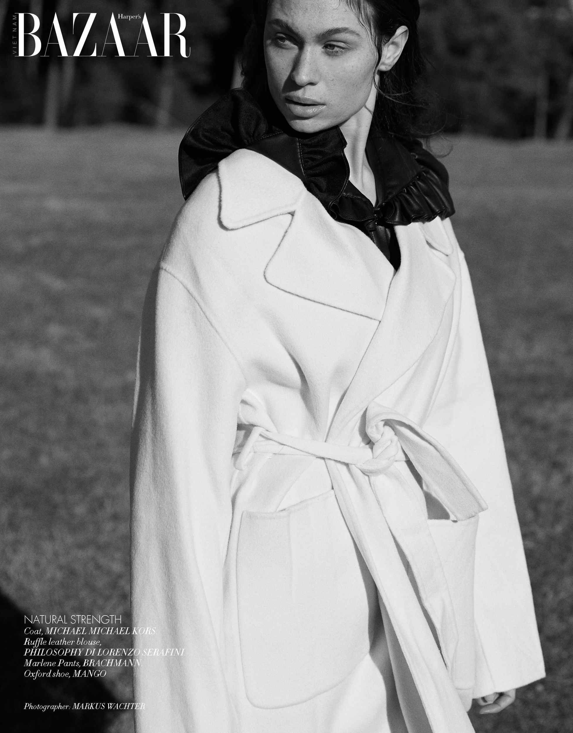 Harper's Bazaar Vietnam editorial: white wrap coat with a dark collar, black and white