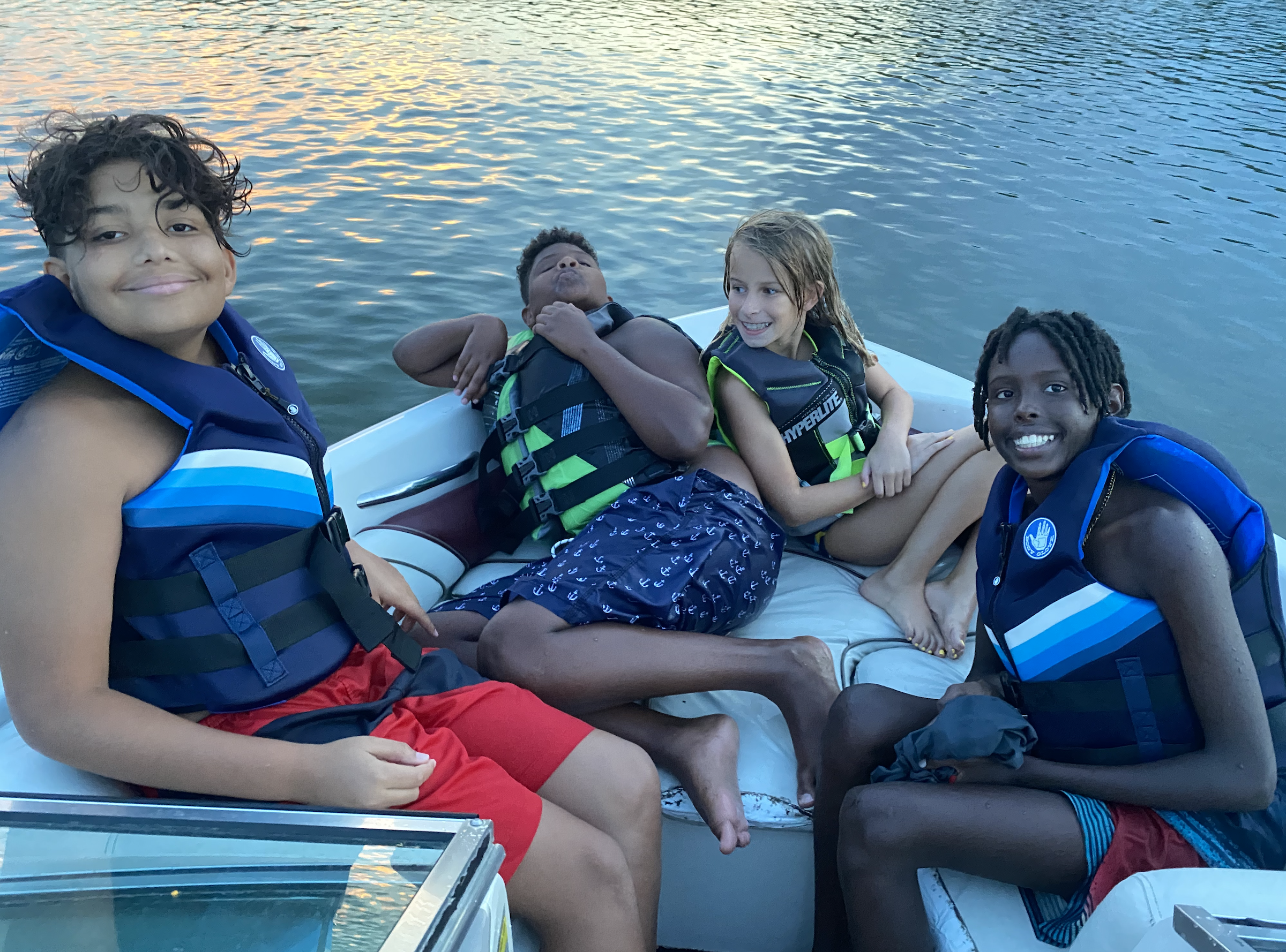 Jeff bought a little boat and took the kids out on the lake with their best friend, Ethan.