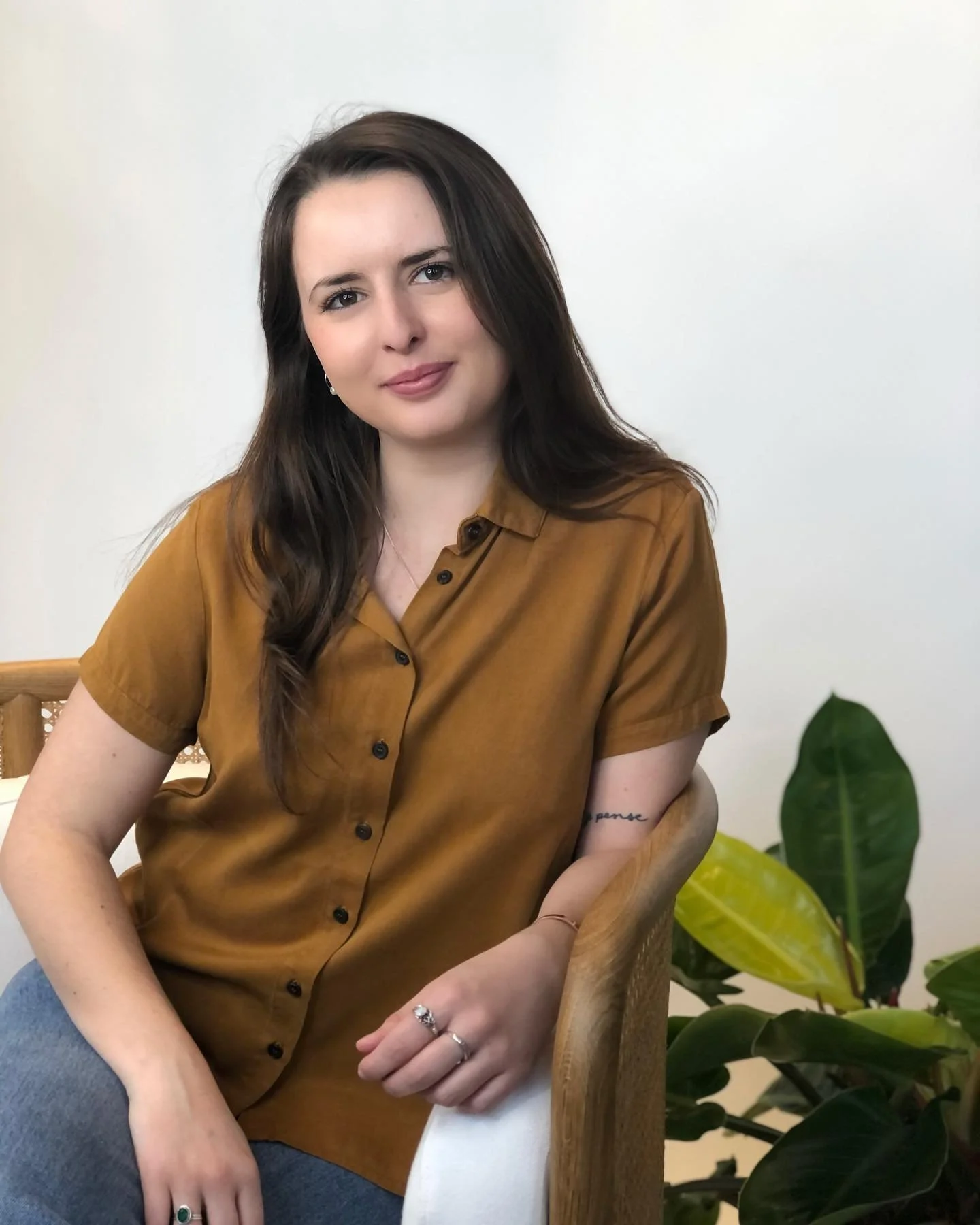 Marilyn Adlington, a white woman with wavy brown hair, smiles at the camera.
