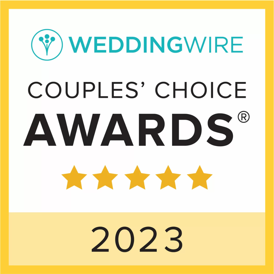 Award badge from WeddingWire for couples' choice in 2023, featuring five gold stars and a wedding flower icon in a circle at the top, with a yellow border.