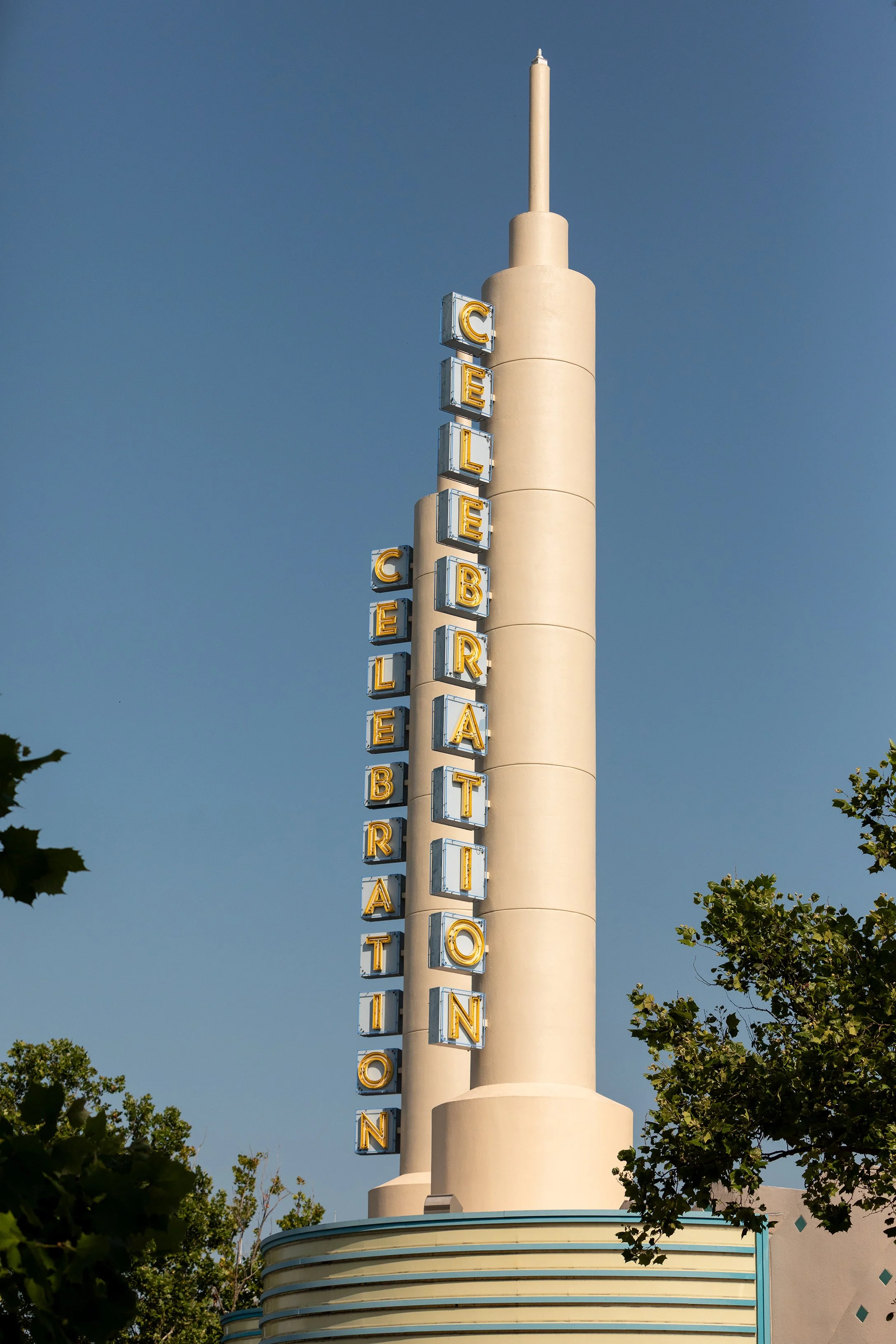 Vintage signage photography of a neon Celebration sign glowing at night