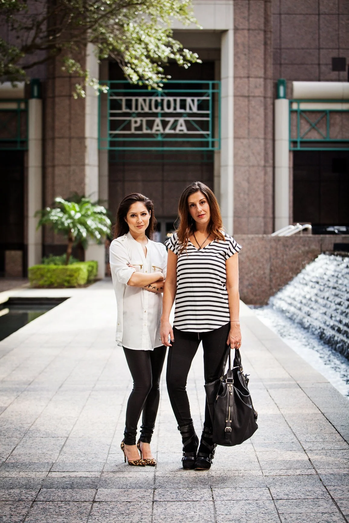 Lifestyle branding photography of two women posing outside the Lincoln Plaza building in Florida