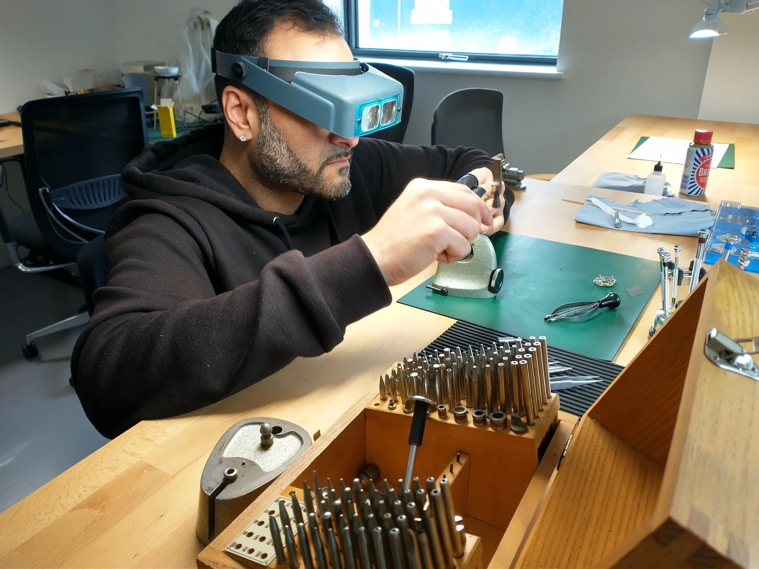 A one to one student learning how to use a staking set.jpg