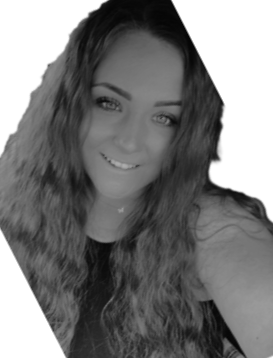 Black and white portrait of a woman with long hair wearing glasses and a patterned top.