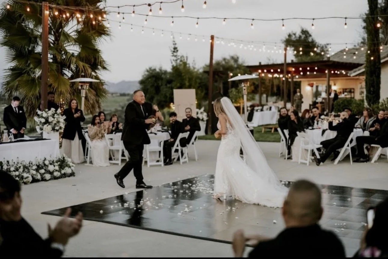 Bride and Groom dancing on Black Specialty Dance Floor