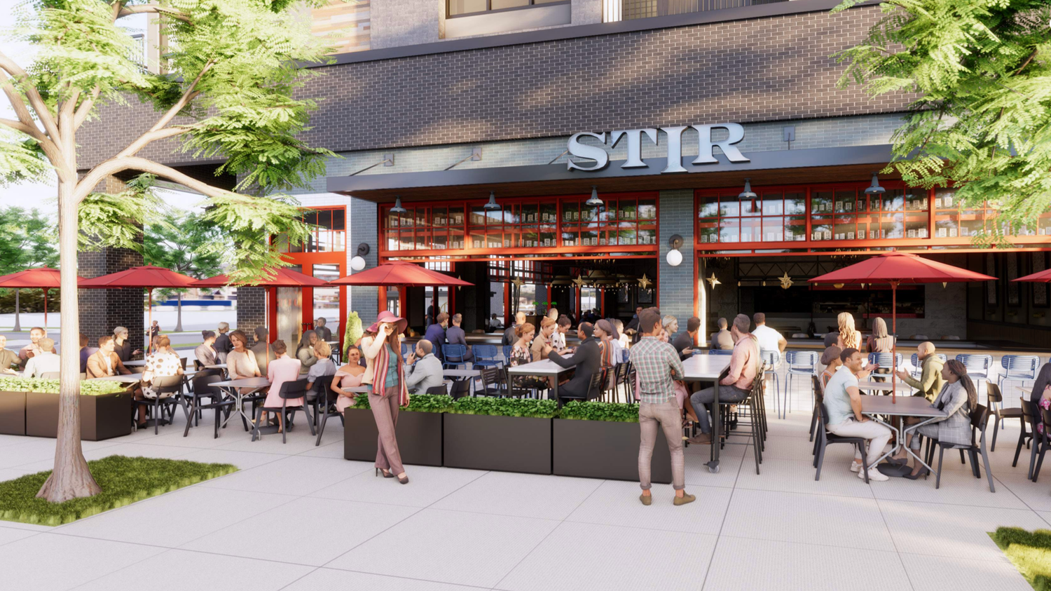Outdoor dining patio with people sitting at tables under red umbrellas in front of a modern building with large windows and the sign 'STR' above the entrance.