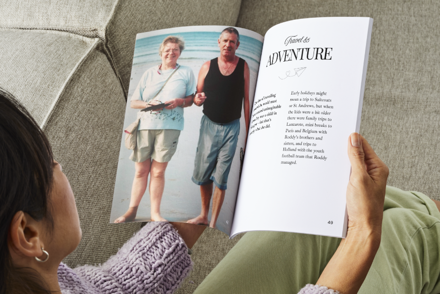 Family reading a Story of Life photo book, celebrating the life of a loved one.
