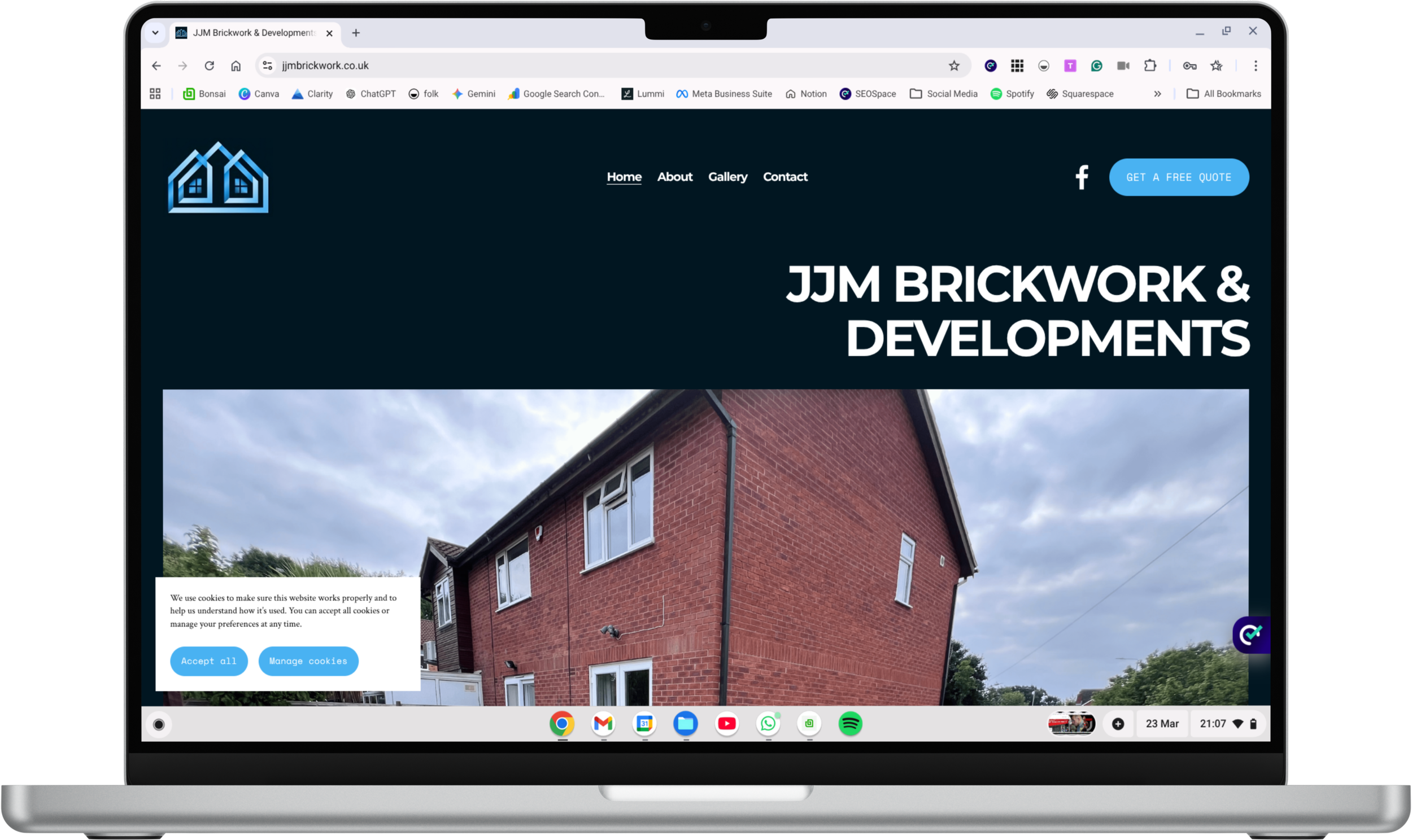 Screenshot of a website homepage for JJM Brickwork & Developments, showing a side of a brick house and navigation options.