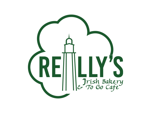 Logo for Reilly's Irish Bakery and To Go Cafe, featuring a green shamrock with a lighthouse outline inside and the business name in green text.